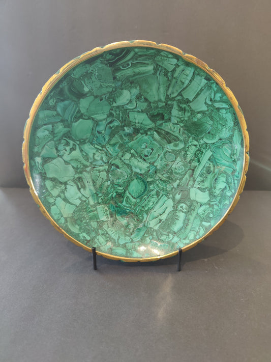 Polished green malachite decorative bowl with a gold rim, 8 inches across, banded green stone