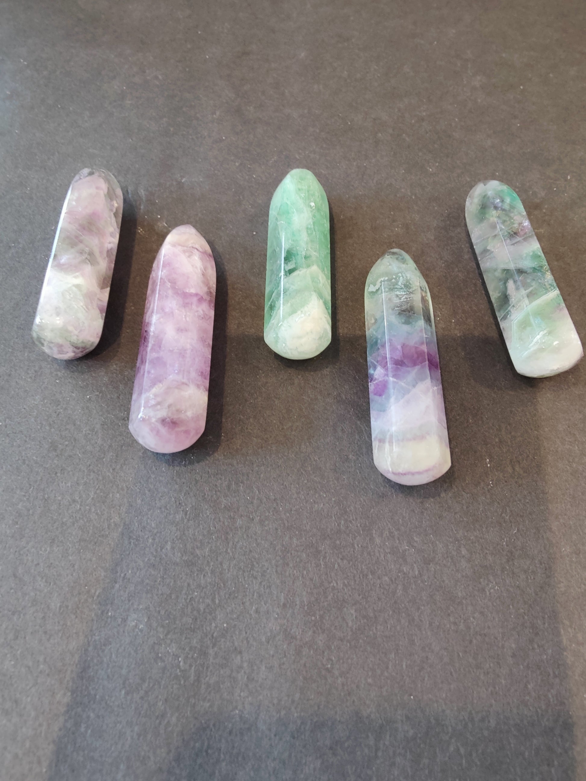 Polished multi-colour fluorite point with green, purple and clear banding — view 3