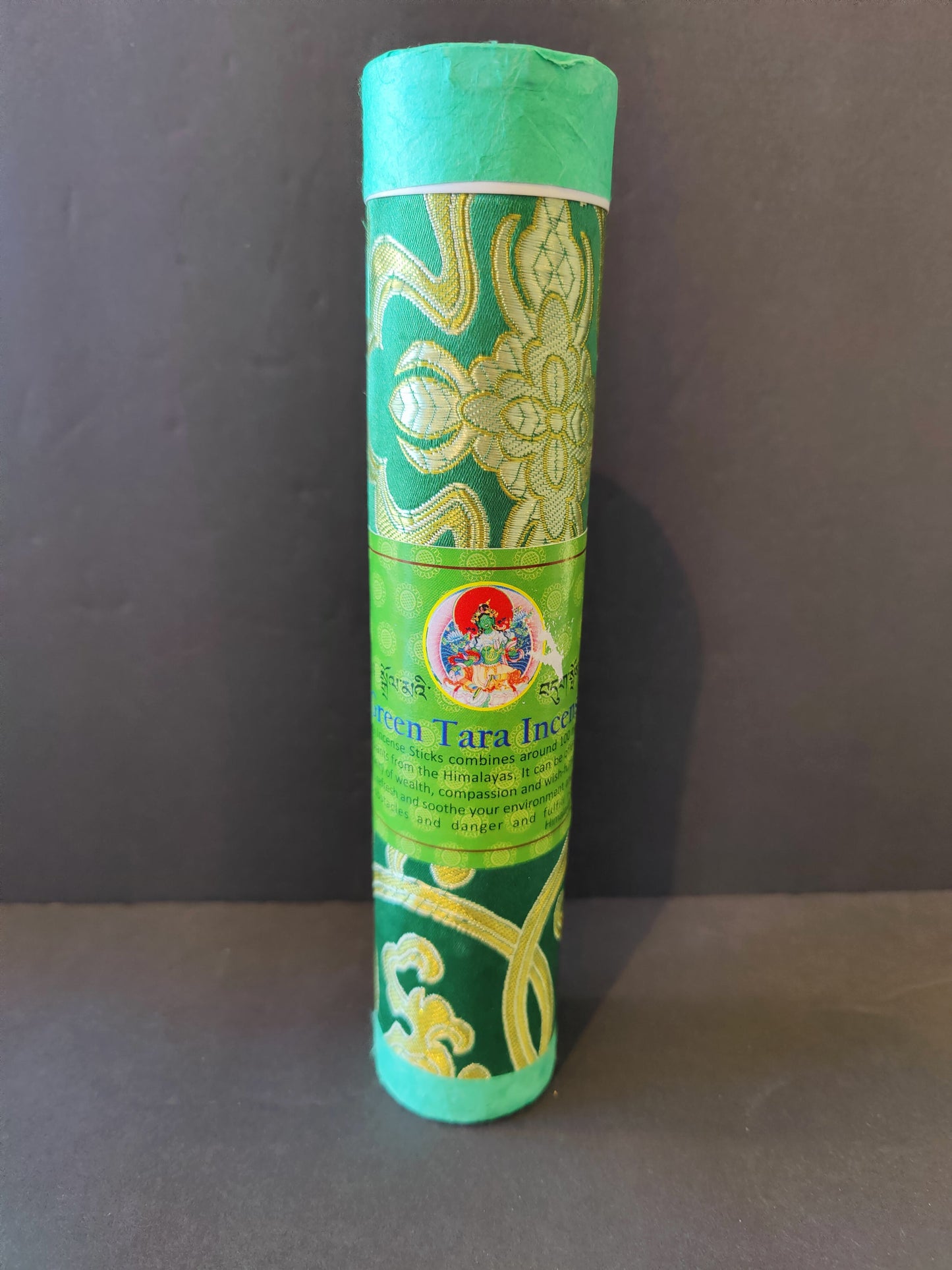 Bundle of hand-rolled Tibetan incense sticks from Nepal tied with cord, on a dark surface — view 6