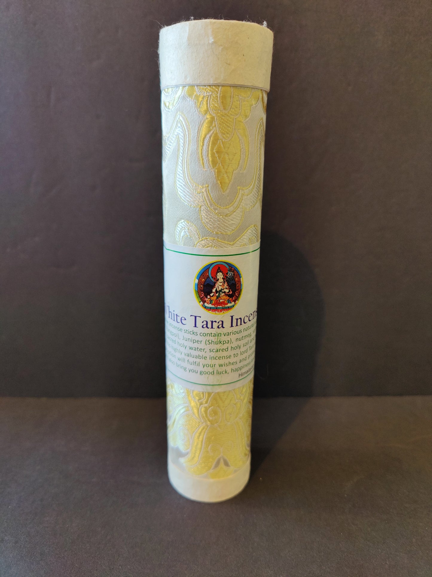 Bundle of hand-rolled Tibetan incense sticks from Nepal tied with cord, on a dark surface — view 7