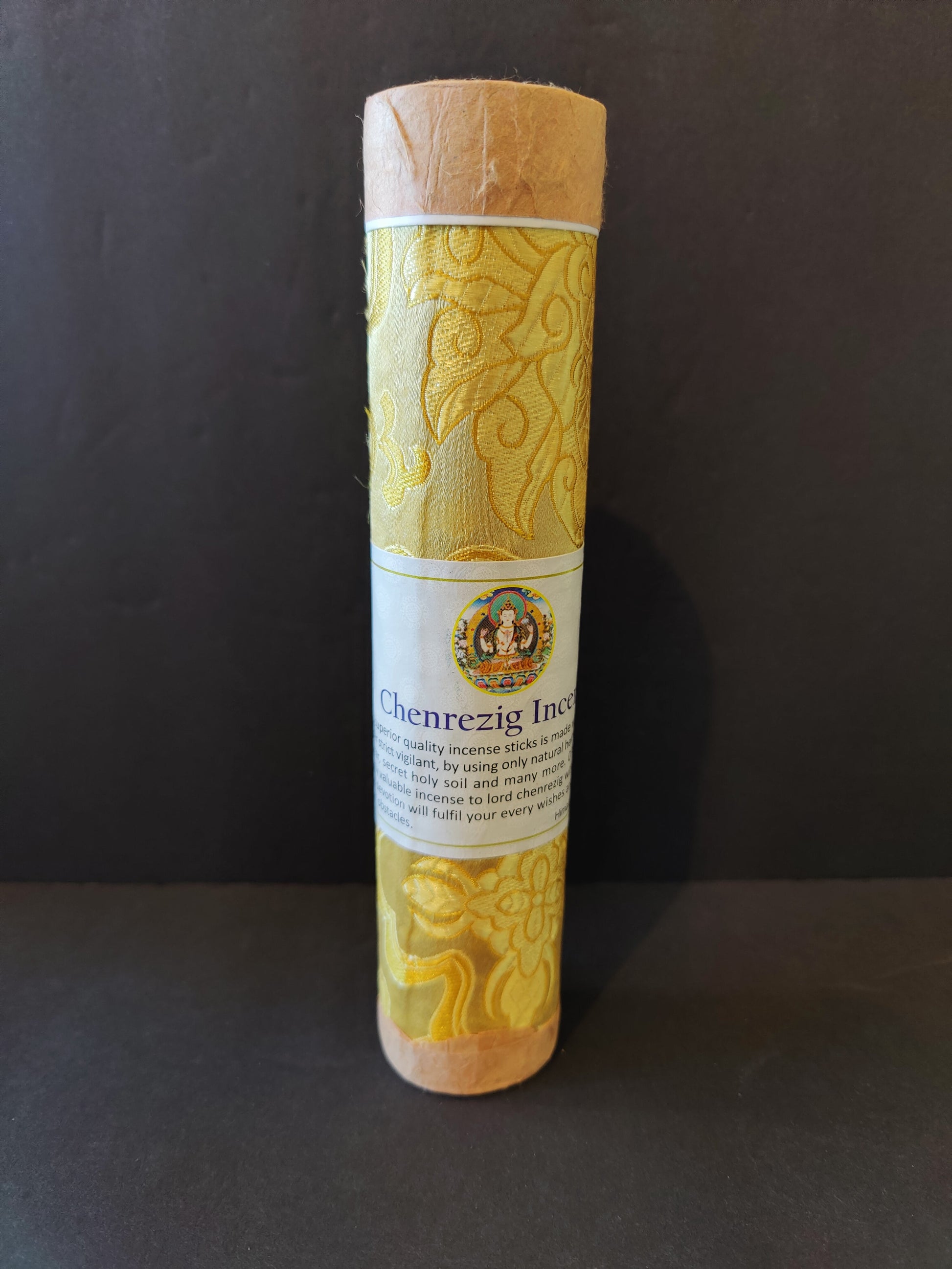 Bundle of hand-rolled Tibetan incense sticks from Nepal tied with cord, on a dark surface — view 9