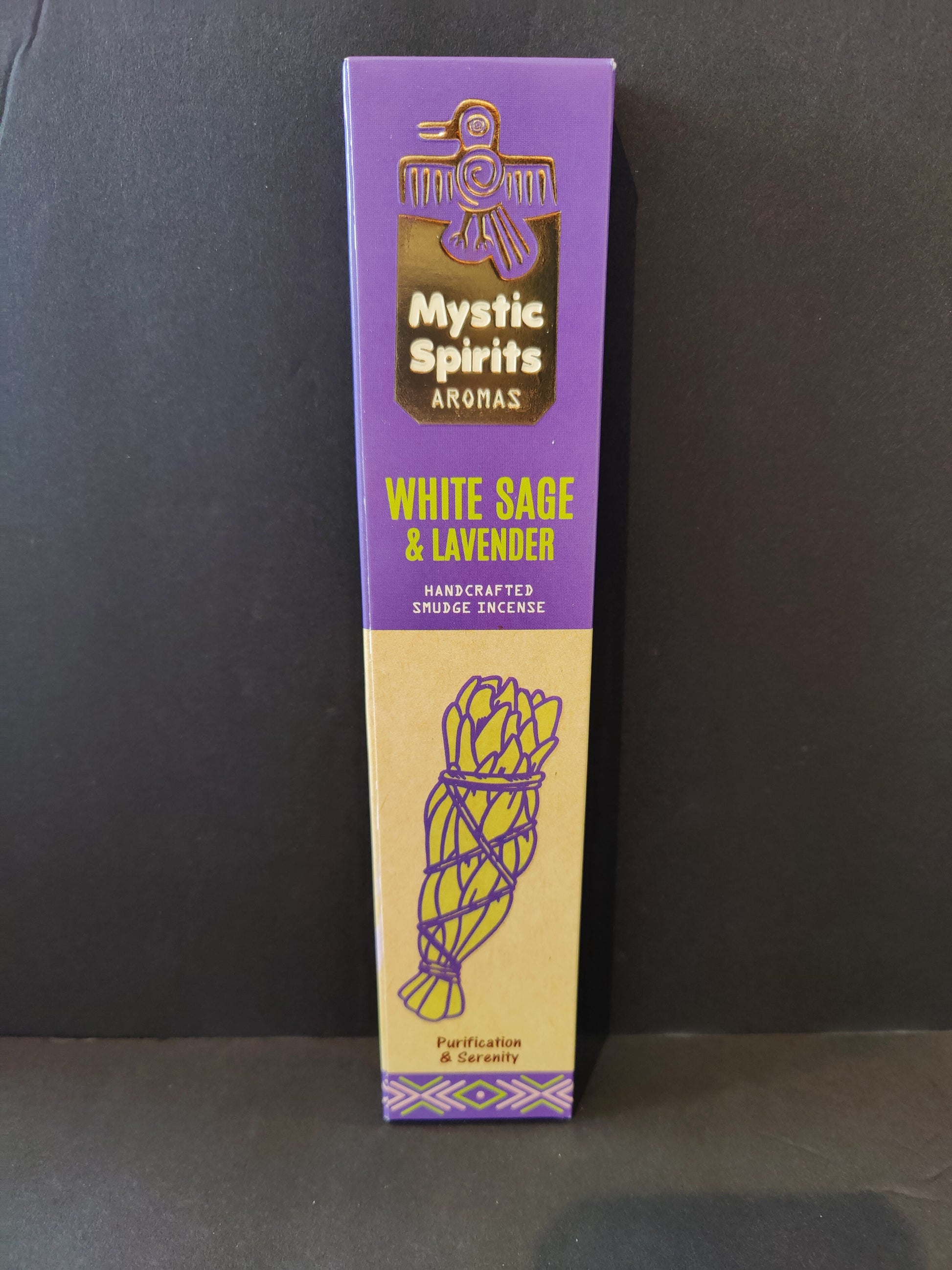 Pack of white sage smudge incense sticks fanned out on a dark surface — view 2