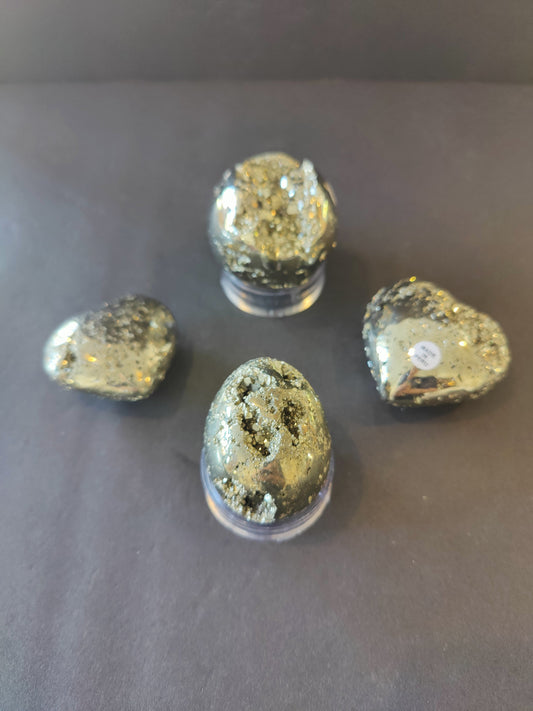 Polished pyrite spheres, eggs and hearts from Peru with a metallic gold surface, 40 to 65 millimetres