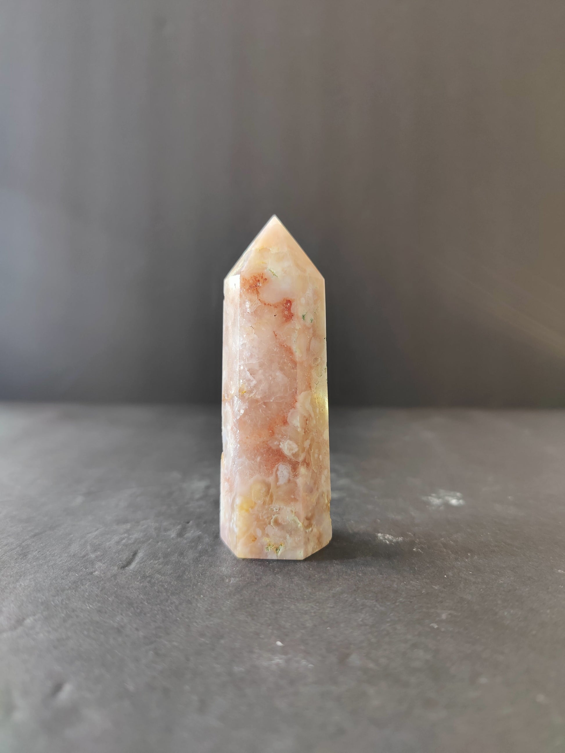 Polished flower agate tower in soft pink with white blossom-like plumes through the stone — view 2