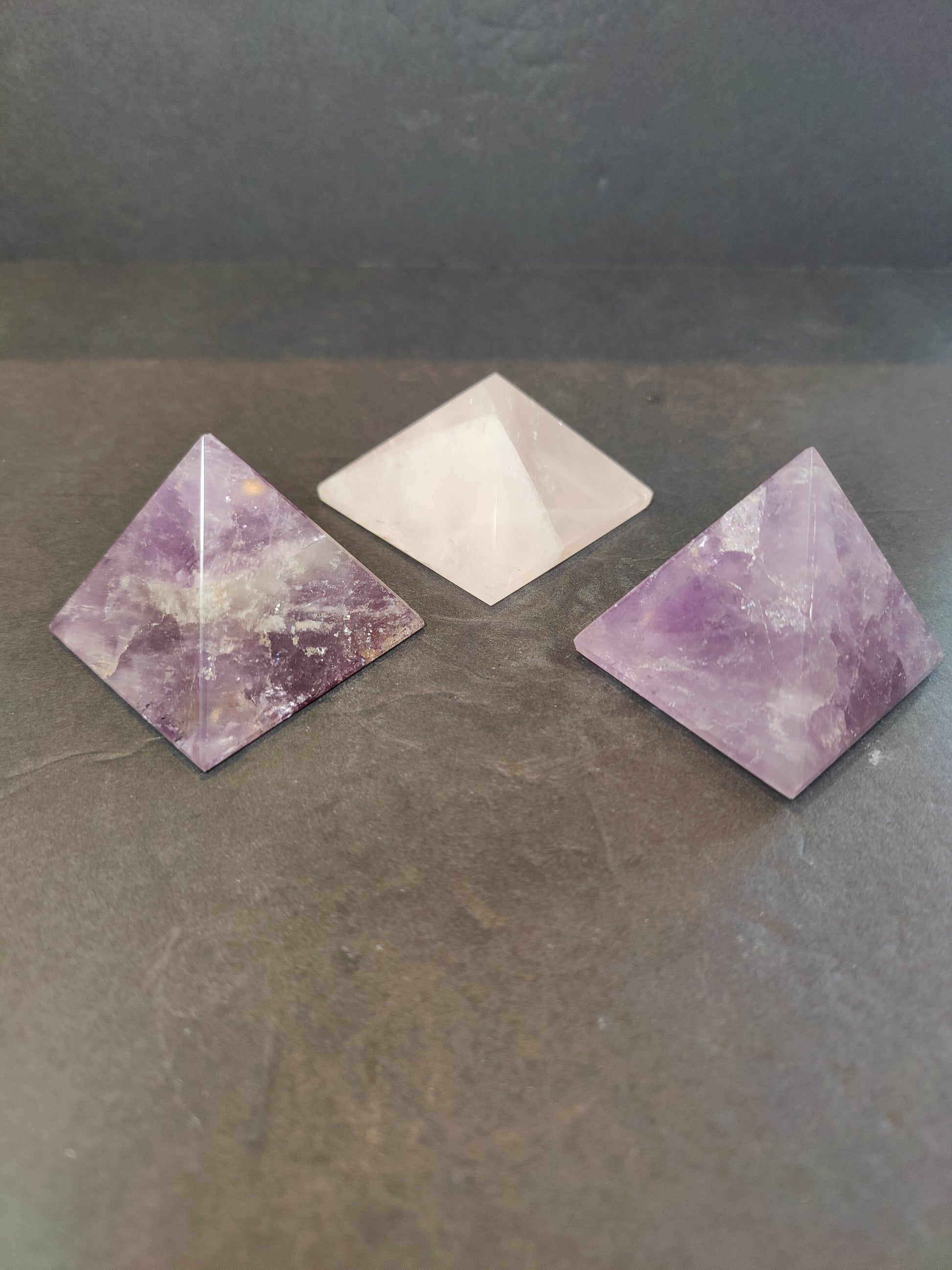 Polished crystal pyramid sculptures in assorted stones including amethyst, tiger eye, black obsidian and rose quartz — view 2