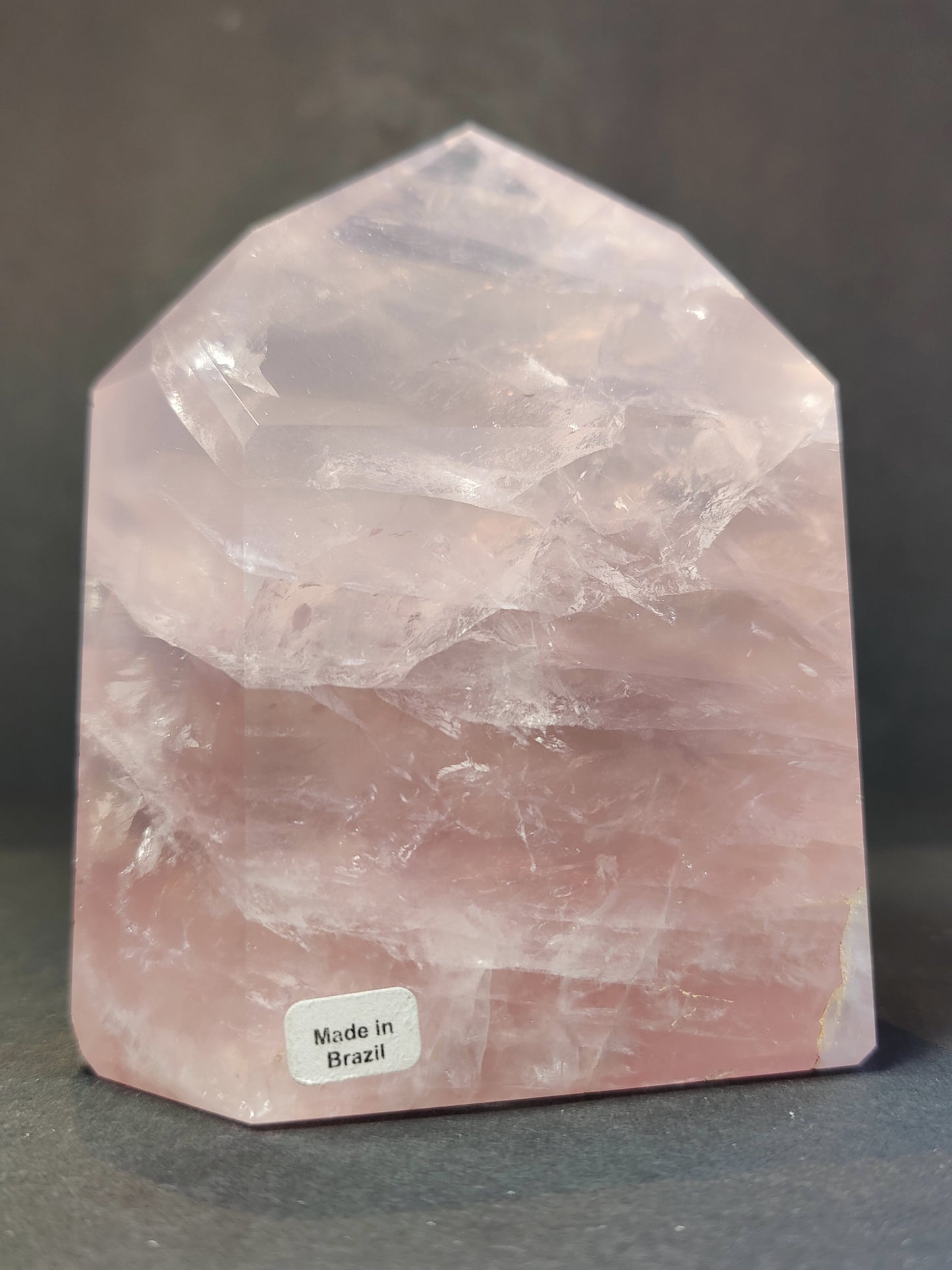 Polished rose quartz obelisk tower in soft translucent pink, standing upright — view 4