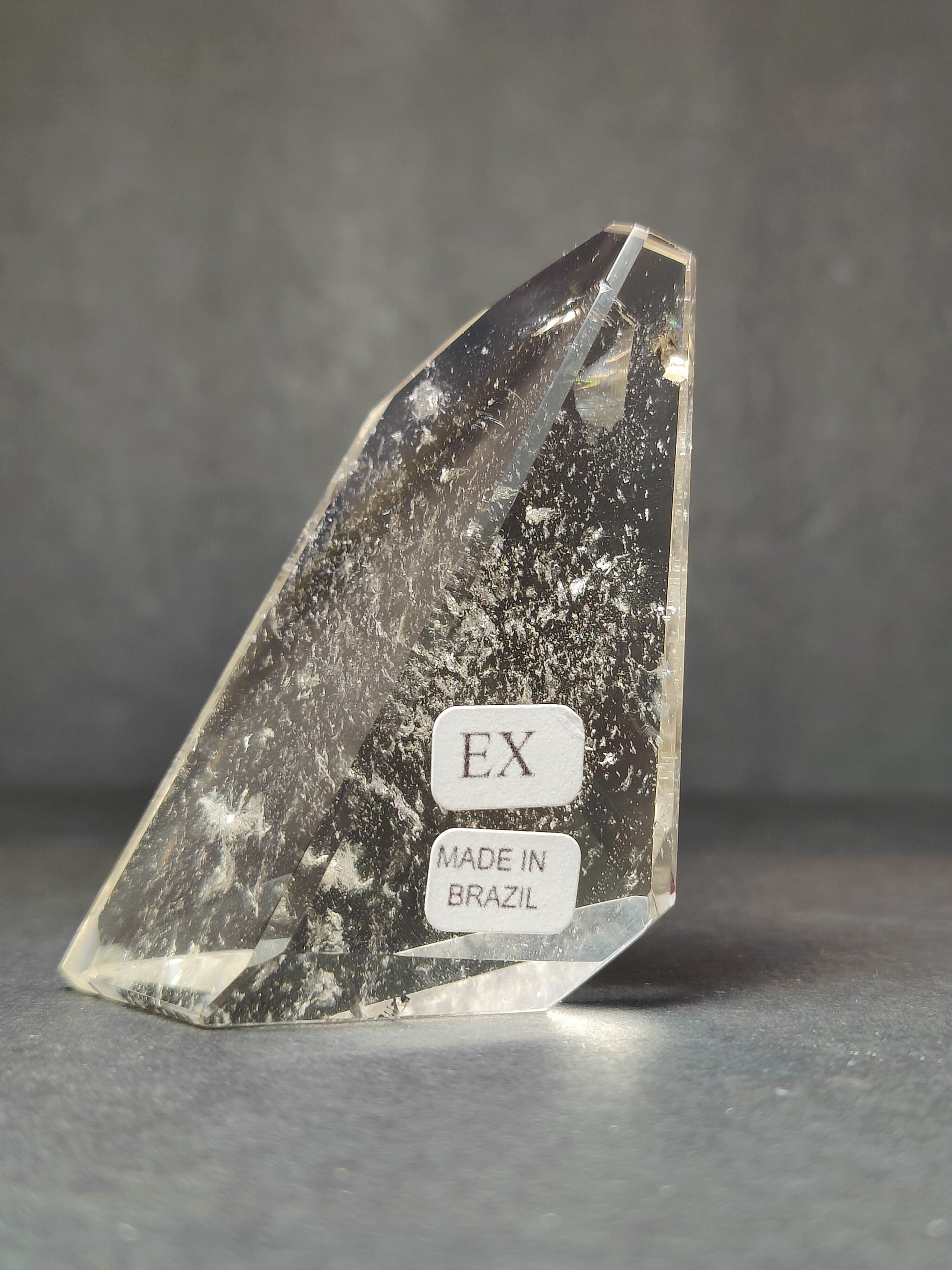 Side view of the polished Smoky & Clear Quartz Free Form Sculpture showing its colour and inclusions