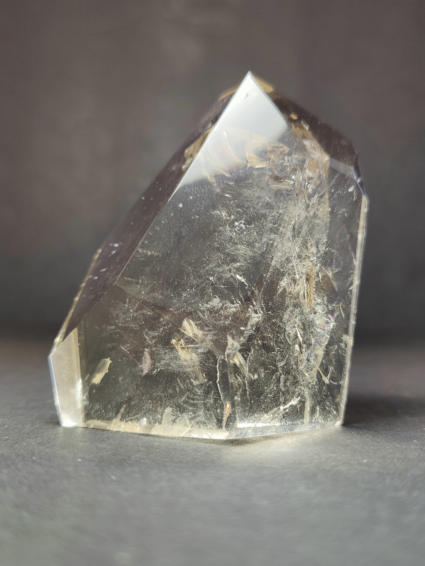 The Smoky & Clear Quartz Free Form Sculpture photographed against a plain backdrop for scale