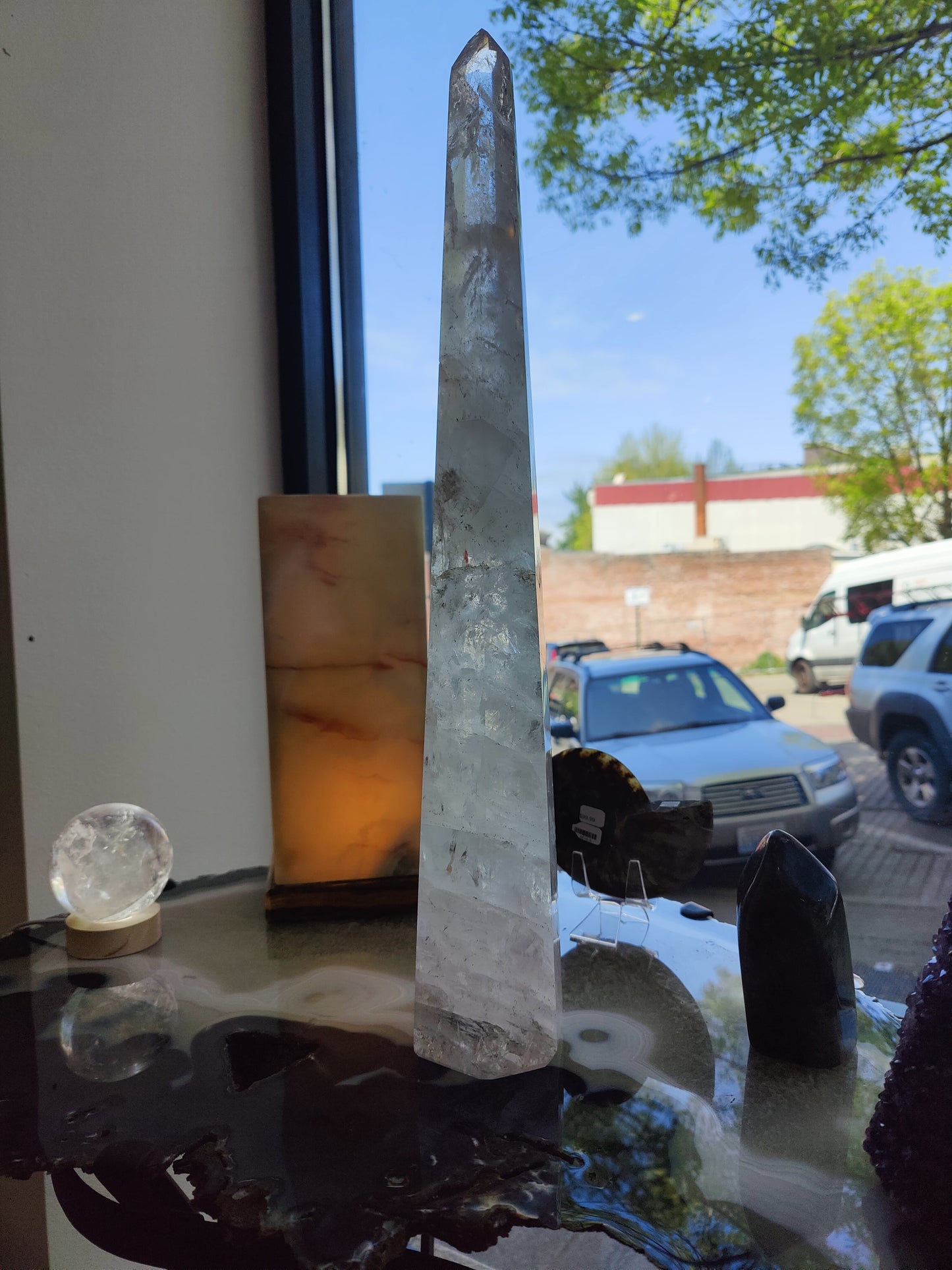 Tall polished clear quartz obelisk standing 20.5 inches, with natural internal veils — view 5
