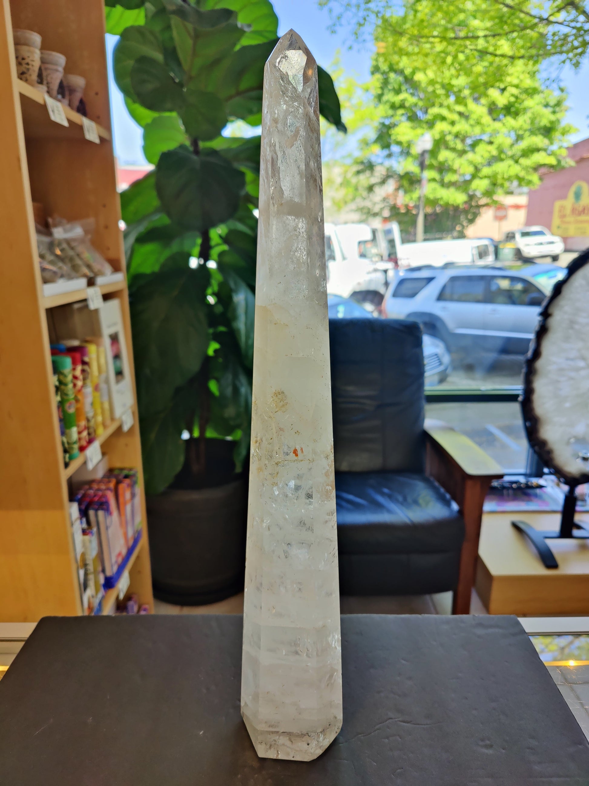 Tall polished clear quartz obelisk standing 20.5 inches, with natural internal veils — view 3