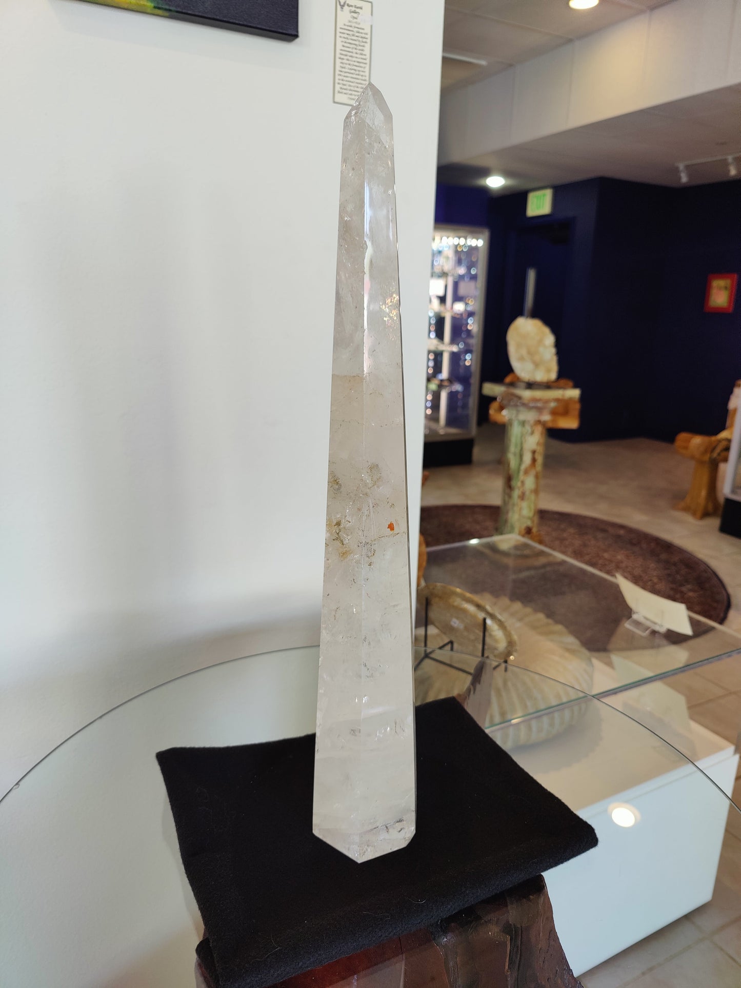 Tall polished clear quartz obelisk standing 20.5 inches, with natural internal veils — view 4