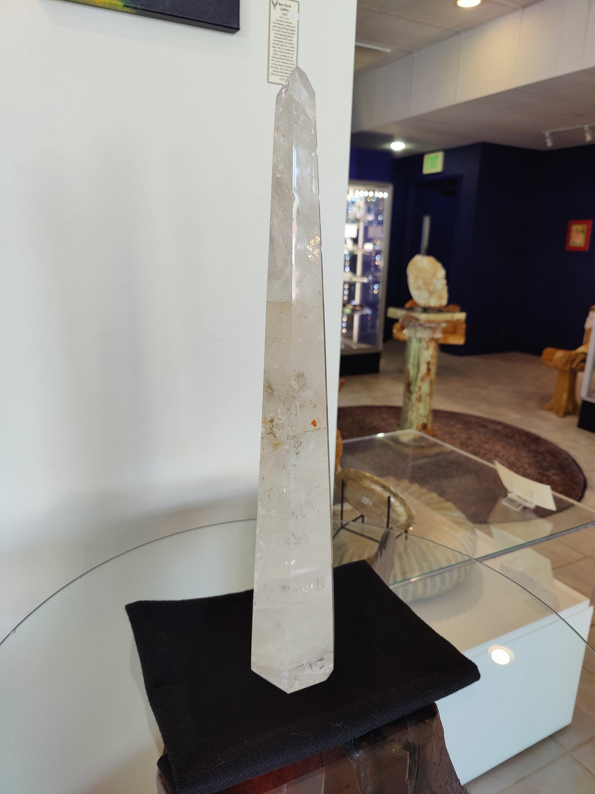 Tall polished clear quartz obelisk standing 20.5 inches, with natural internal veils — view 4
