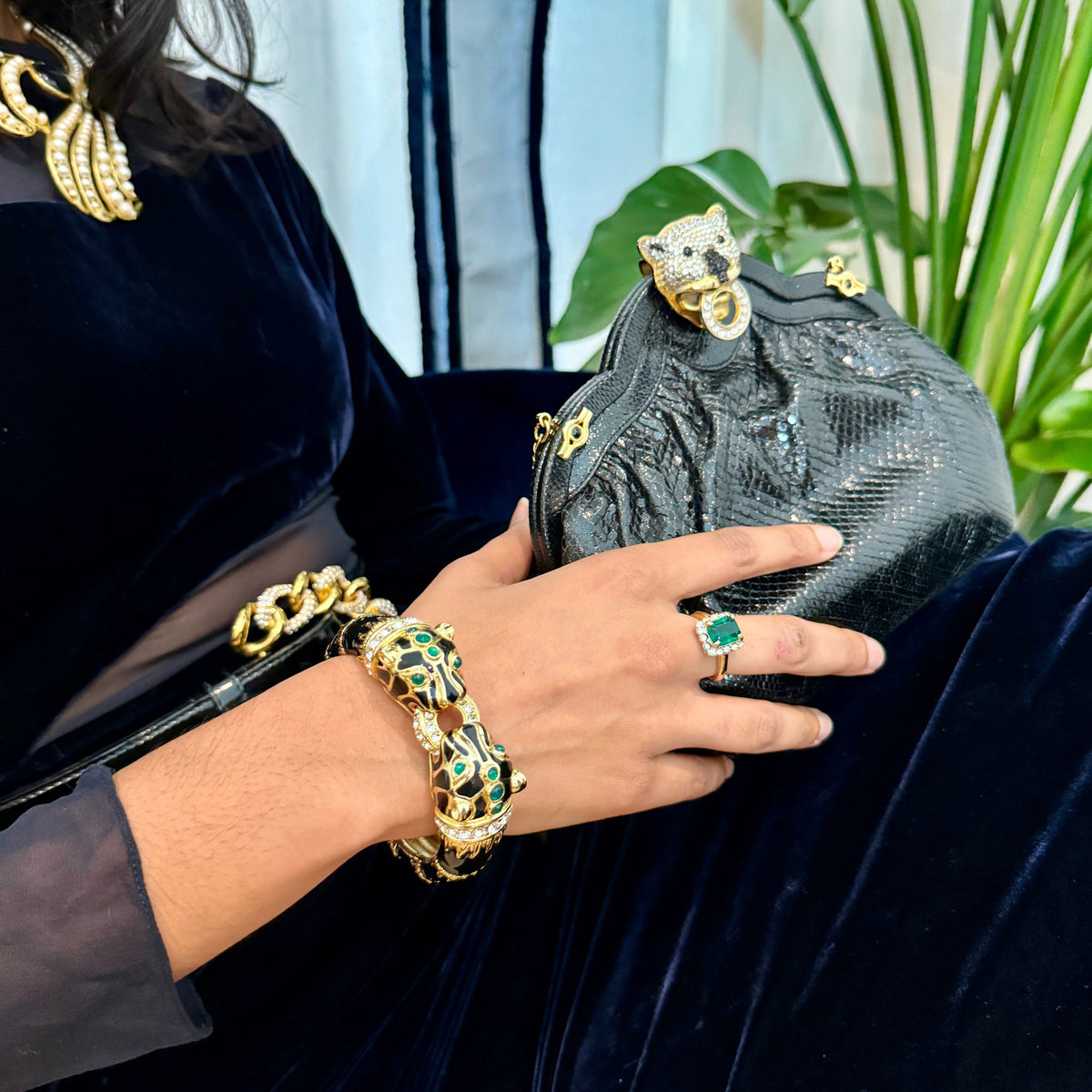 Styling shot: the black panther cuff worn with a chain bracelet, a green stone ring and a black handbag; this listing is the cuff only.