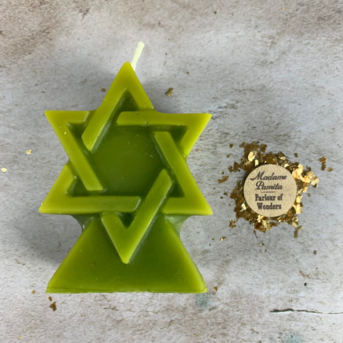 Olive green beeswax Seal of Solomon hexagram candle seen from above