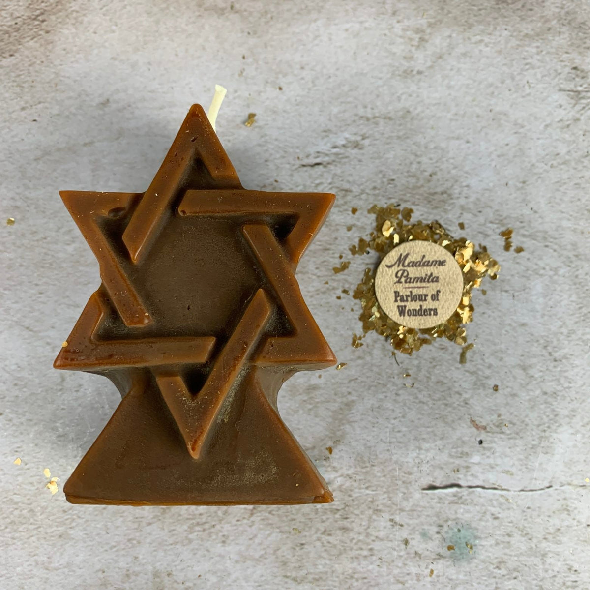 Brown beeswax Seal of Solomon hexagram candle photographed from above
