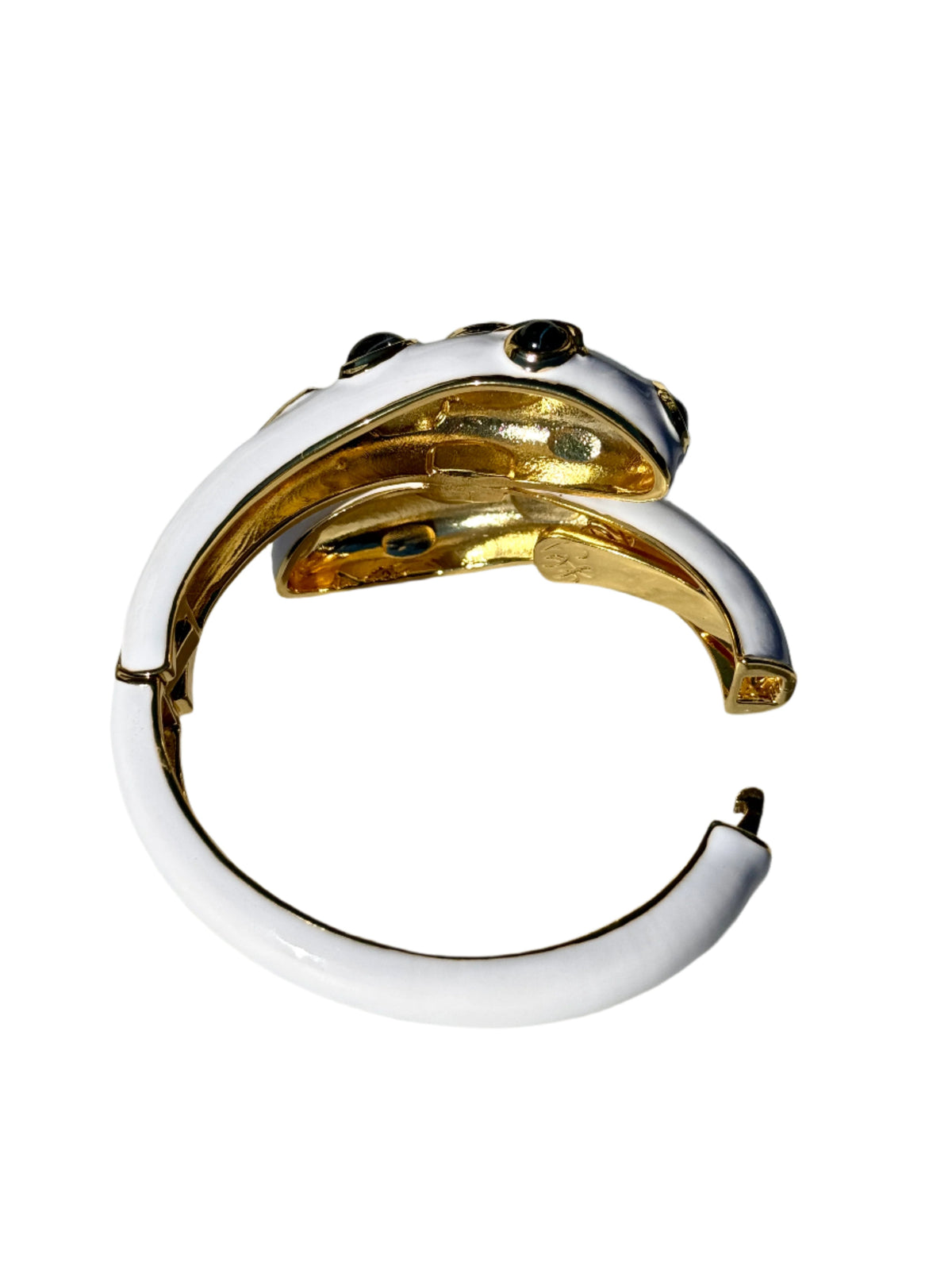 Back of the bracelet showing the gold-tone interior, the hinge and the open ends of the cuff.