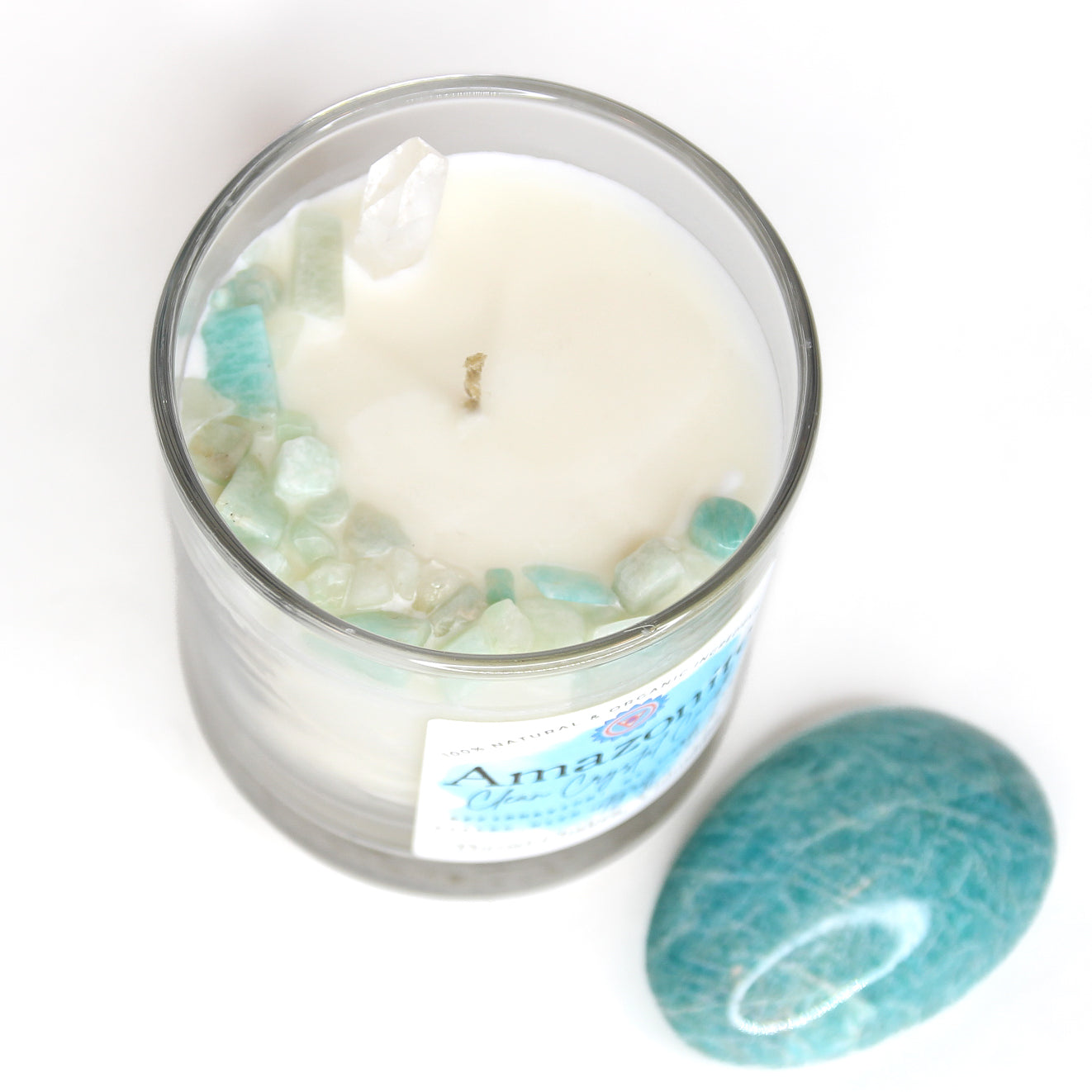 The Amazonite chakra candle with its label and crystal detail
