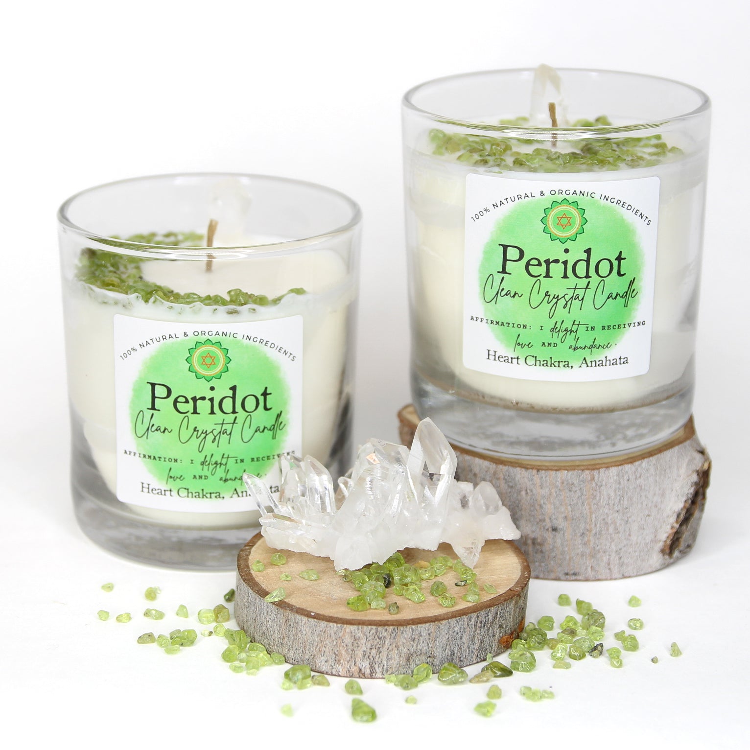 Peridot Clean Crystal Candle in a clear lead-free glass tumbler, topped with green peridot chips and a clear quartz point