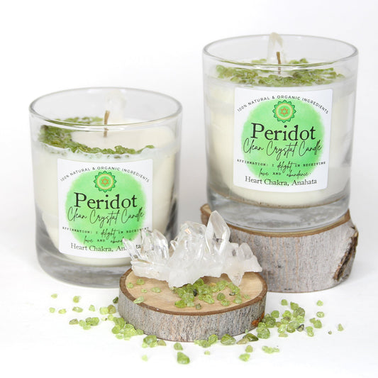 Peridot Clean Crystal Candle in a clear lead-free glass tumbler, topped with green peridot chips and a clear quartz point