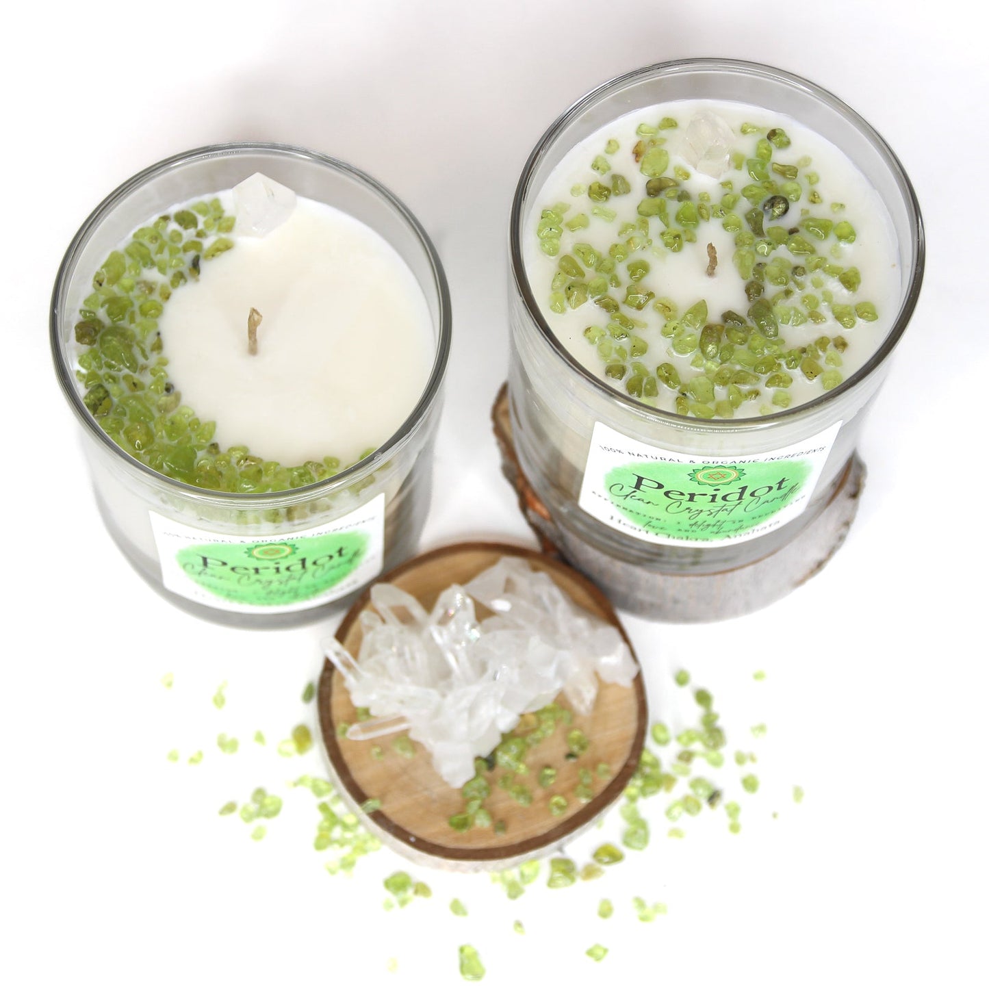 Peridot Clean Crystal Candle in a clear lead-free glass tumbler, topped with green peridot chips and a clear quartz point — product photo 3