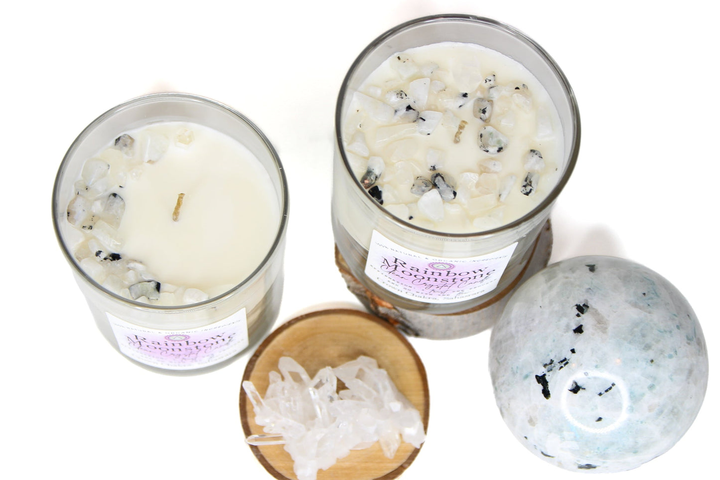 Rainbow Moonstone Clean Crystal Candle in a clear lead-free glass tumbler, topped with rainbow moonstone chips and a clear quartz point — product photo 2