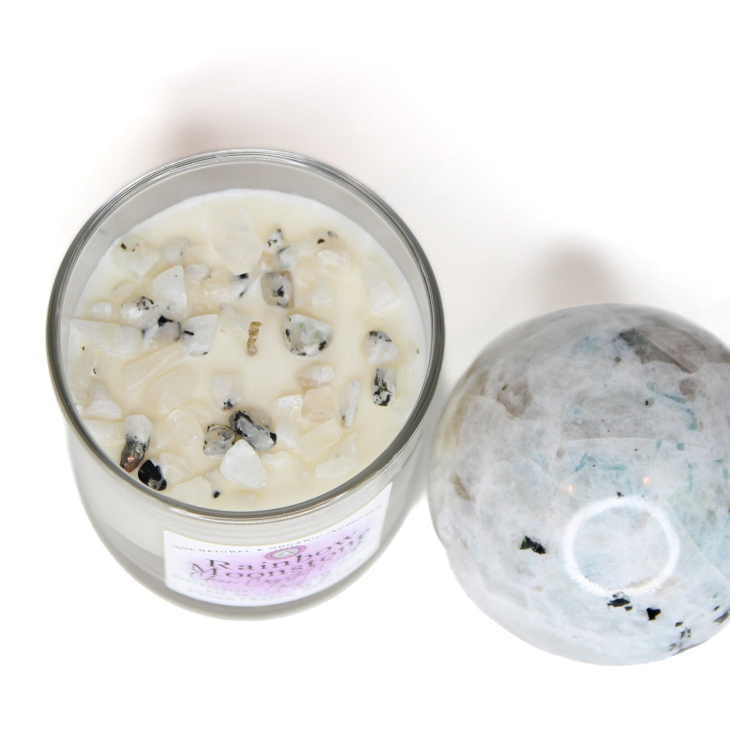 Rainbow Moonstone Clean Crystal Candle in a clear lead-free glass tumbler, topped with rainbow moonstone chips and a clear quartz point — product photo 3