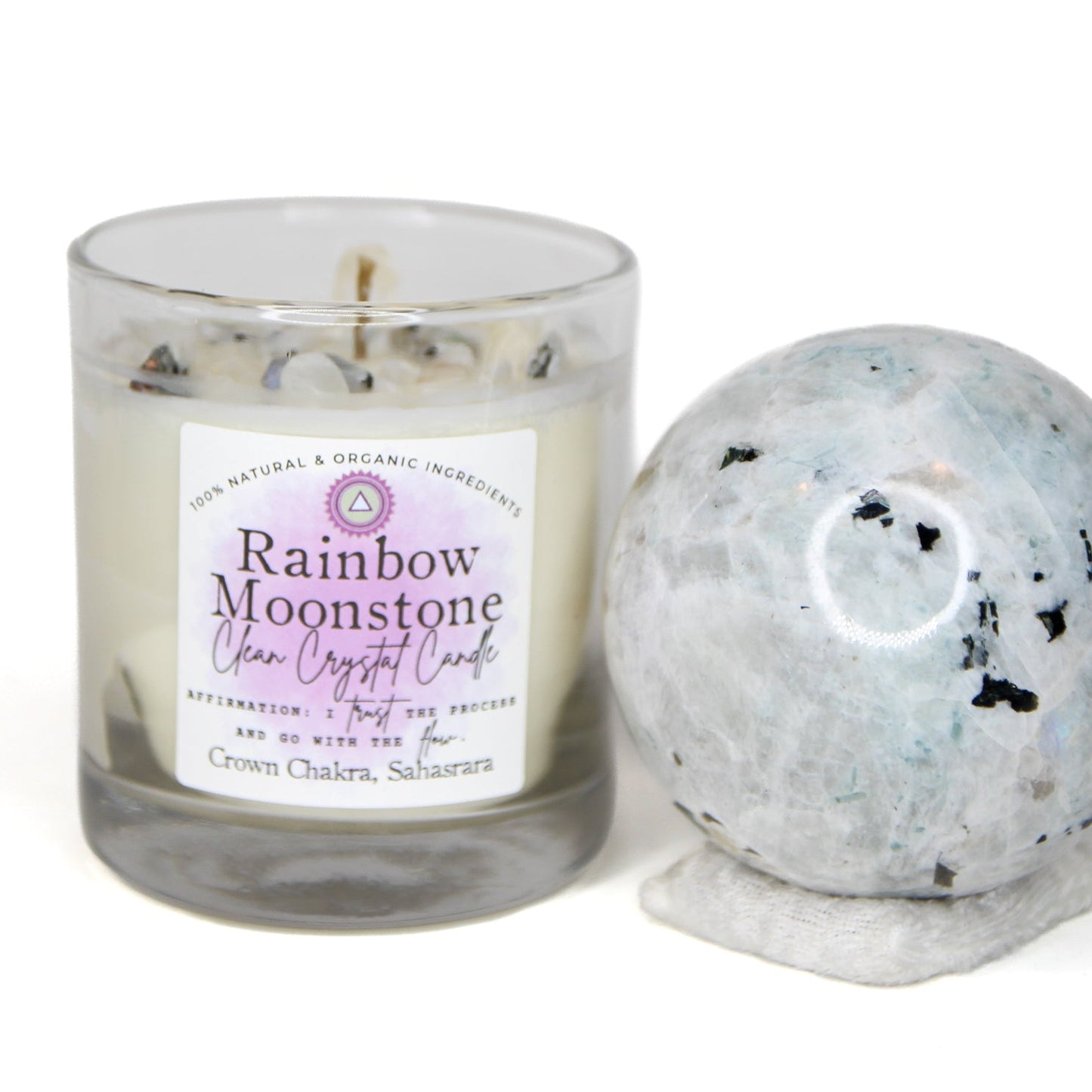 Rainbow Moonstone Clean Crystal Candle in a clear lead-free glass tumbler, topped with rainbow moonstone chips and a clear quartz point — product photo 4