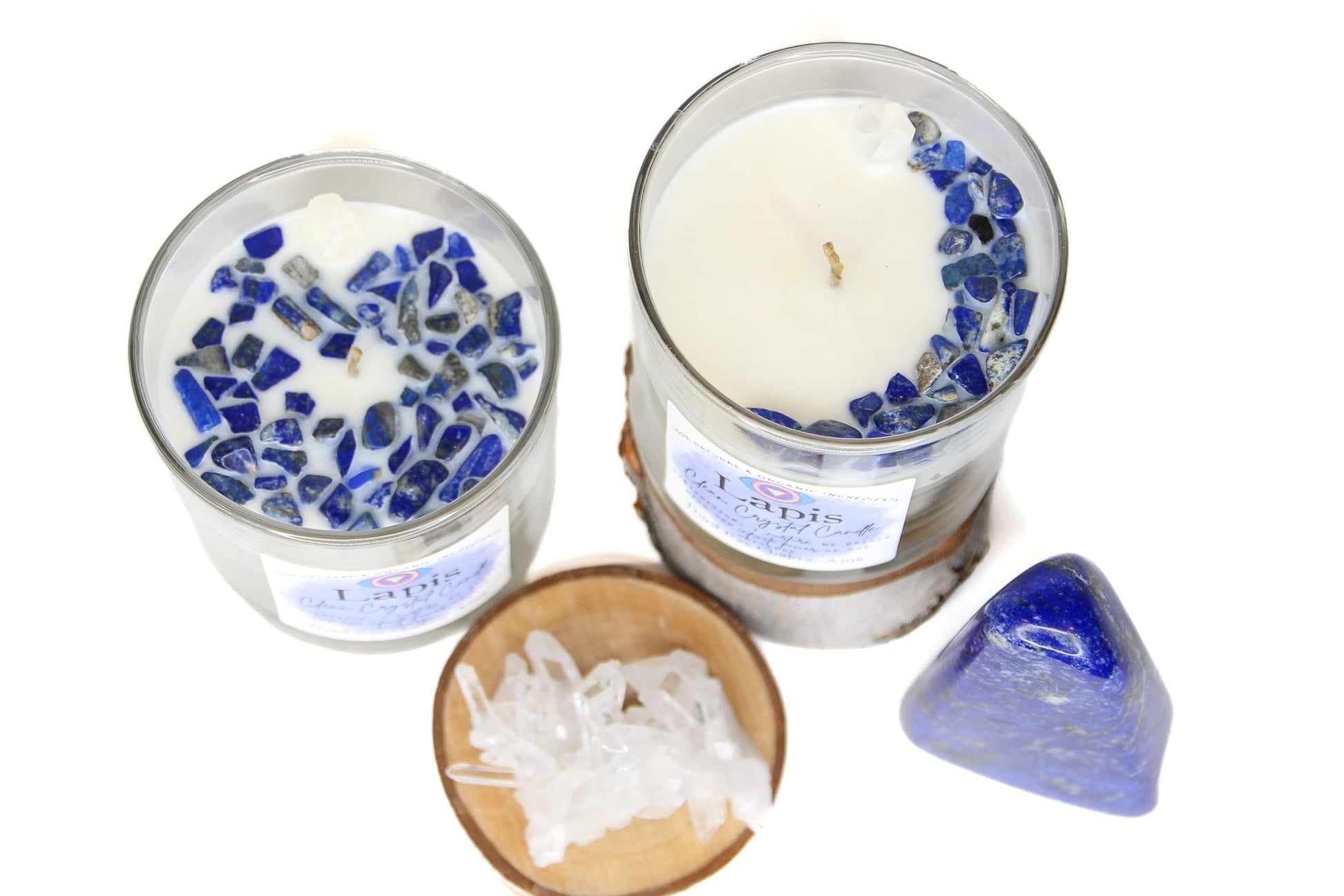 The Lapis Lazuli chakra candle lit on a dark surface