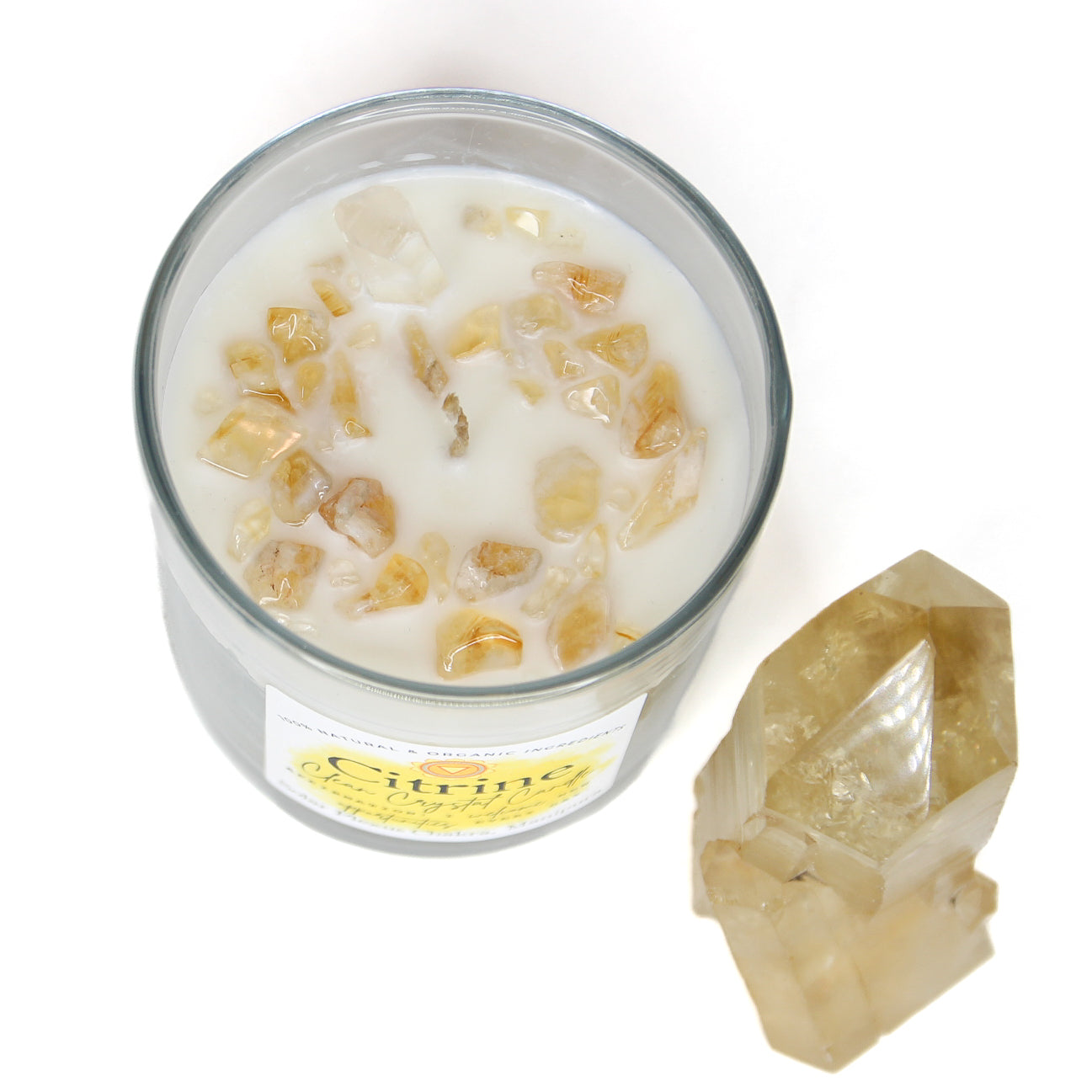 Citrine Clean Crystal Candle in a clear lead-free glass tumbler, topped with golden citrine chips and a clear quartz point — product photo 4