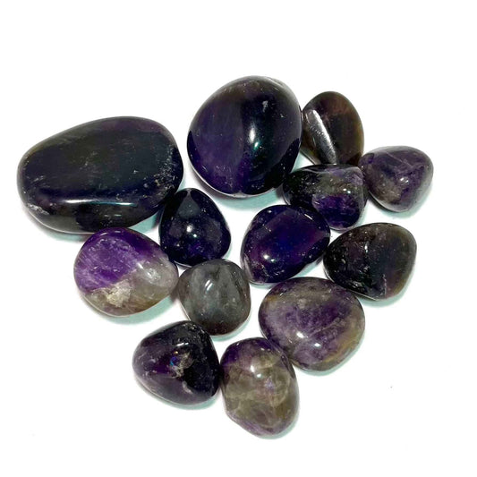 Polished purple amethyst tumbled pocket stone with a glassy surface
