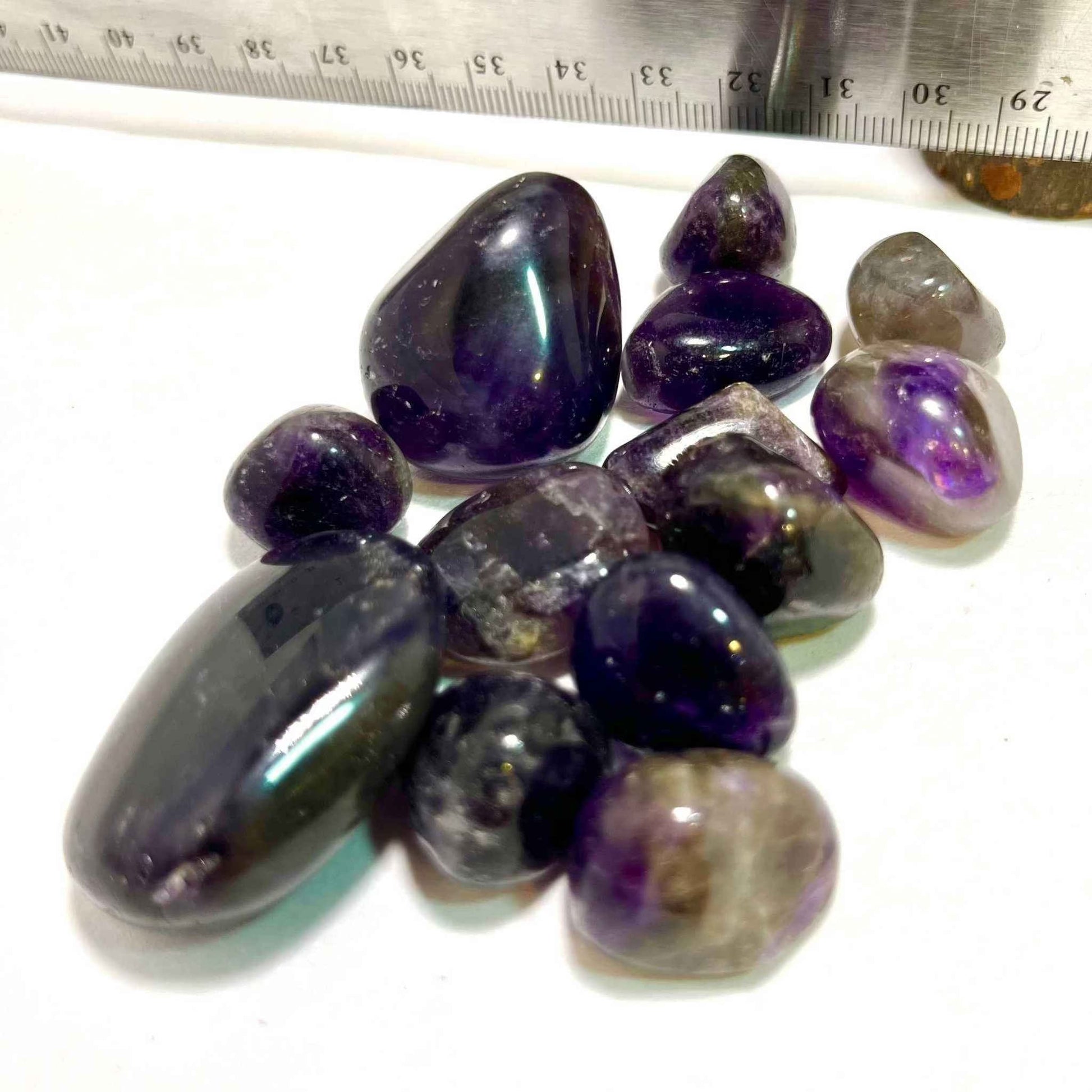 Amethyst tumbled stone showing its translucent violet coloring