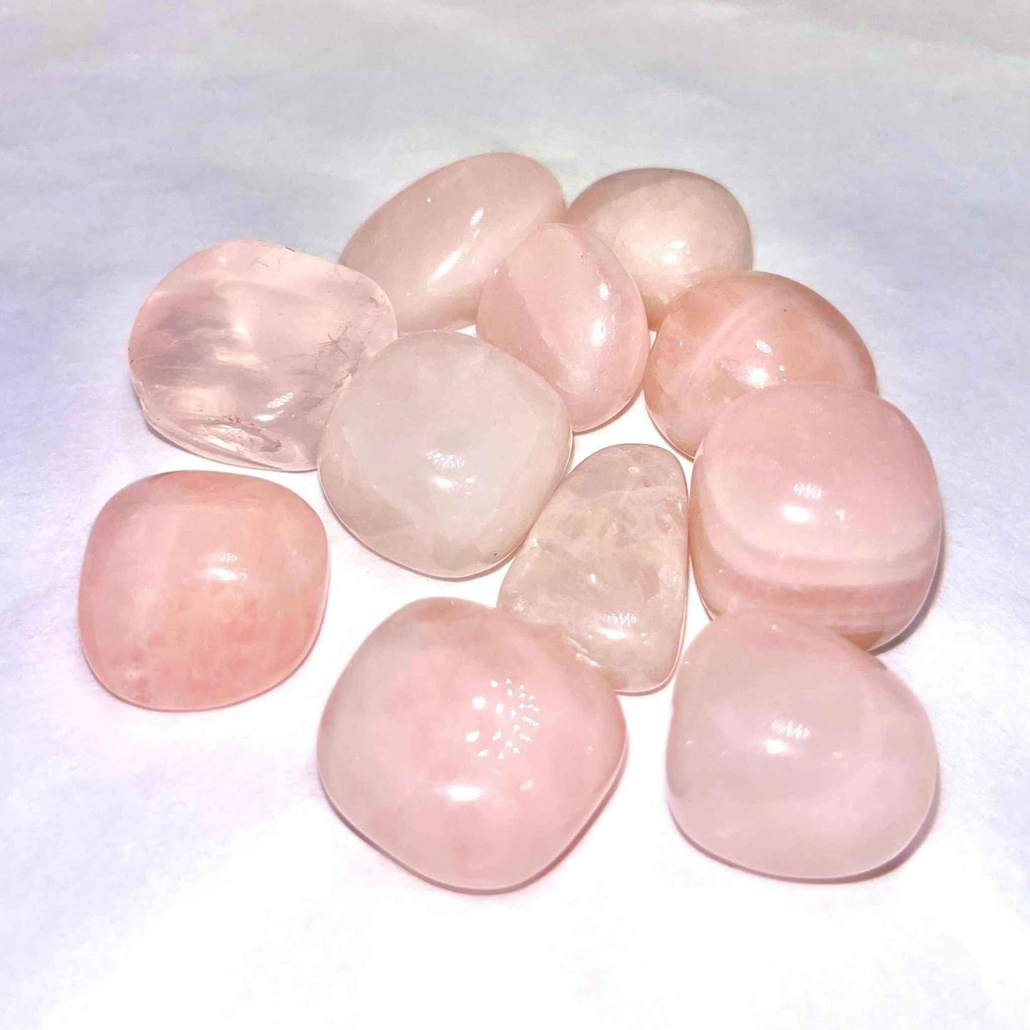 Soft translucent pink rose quartz tumbled pocket stone