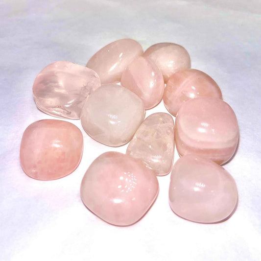 Soft translucent pink rose quartz tumbled pocket stone