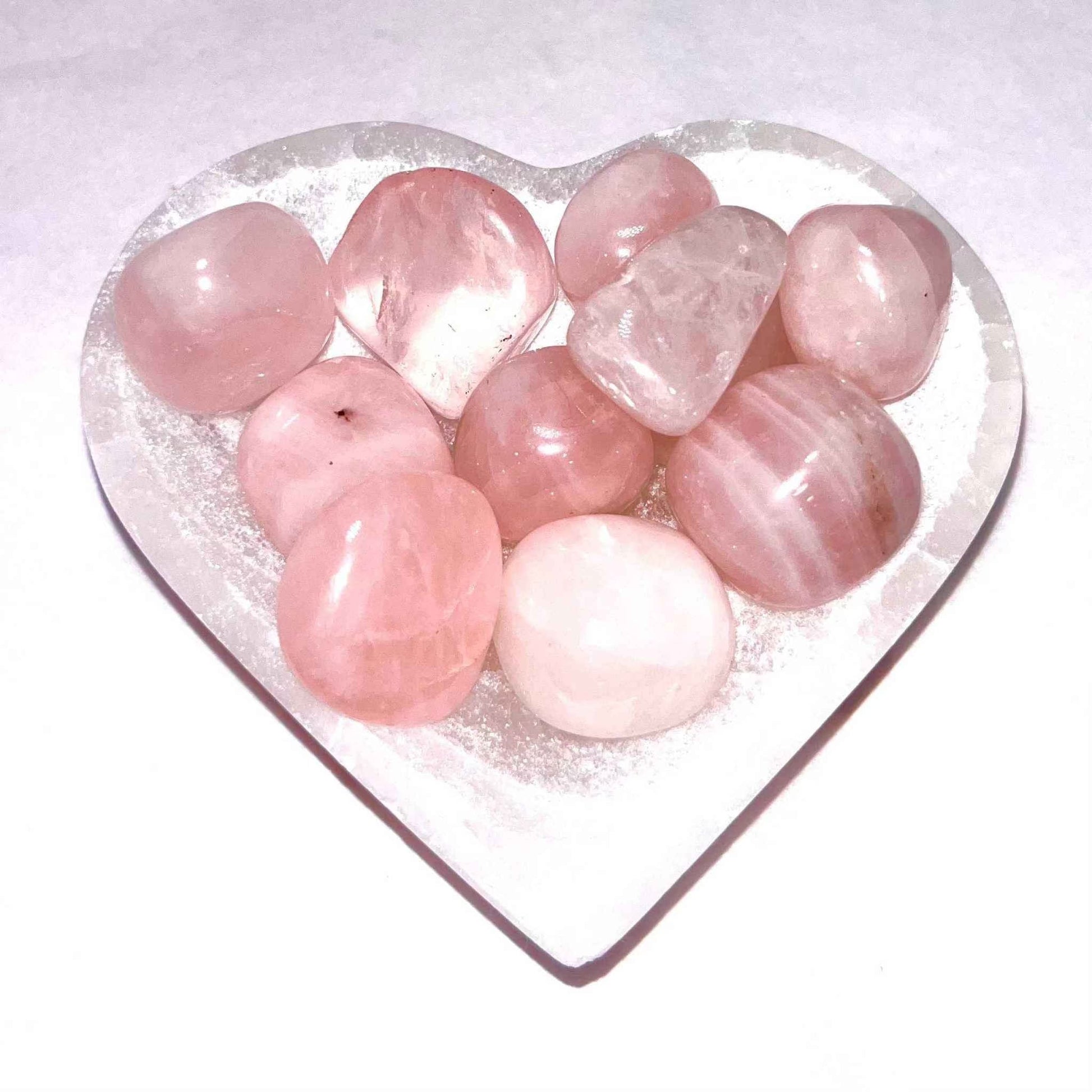 Soft translucent pink rose quartz tumbled pocket stone, additional view