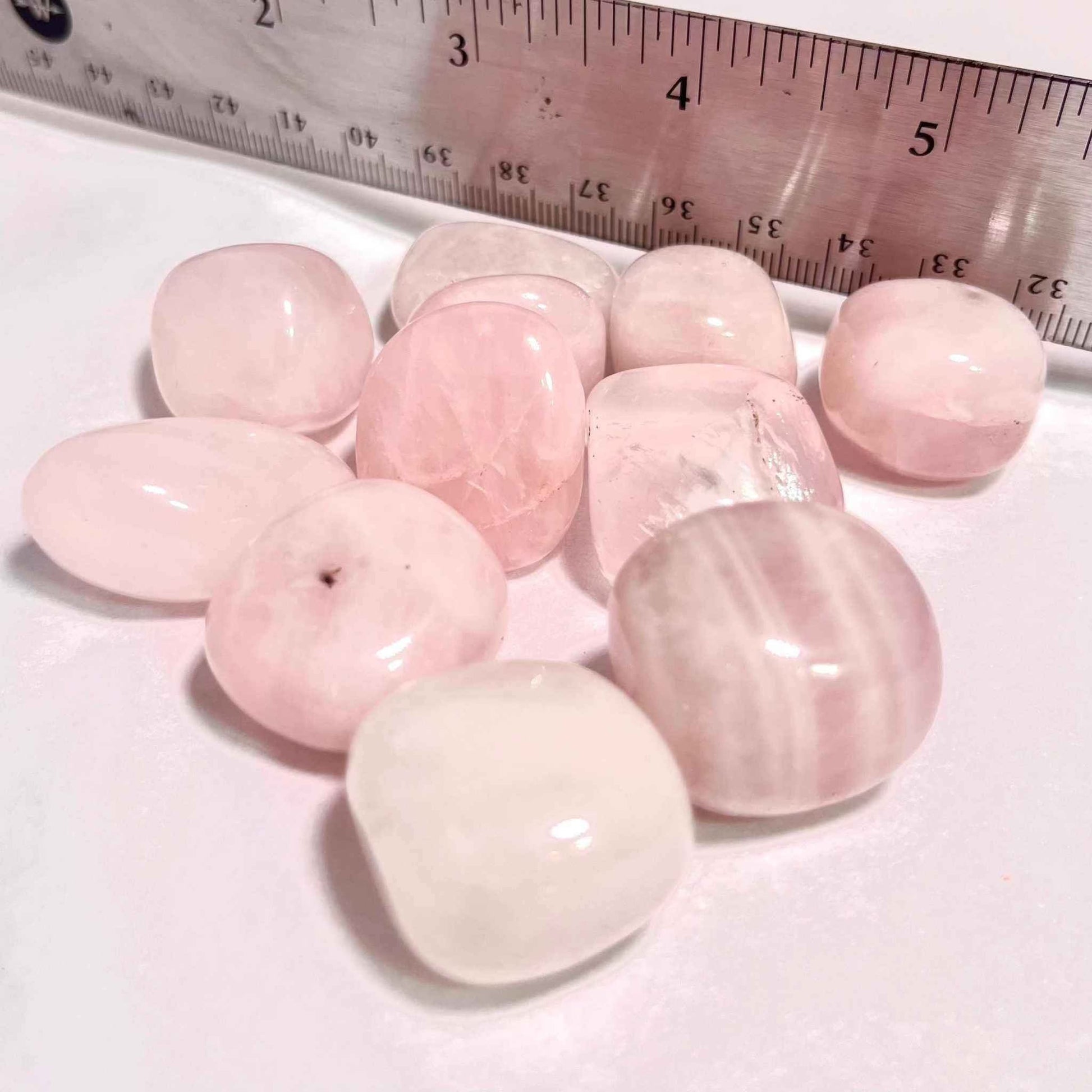 Soft translucent pink rose quartz tumbled pocket stone, alternate view