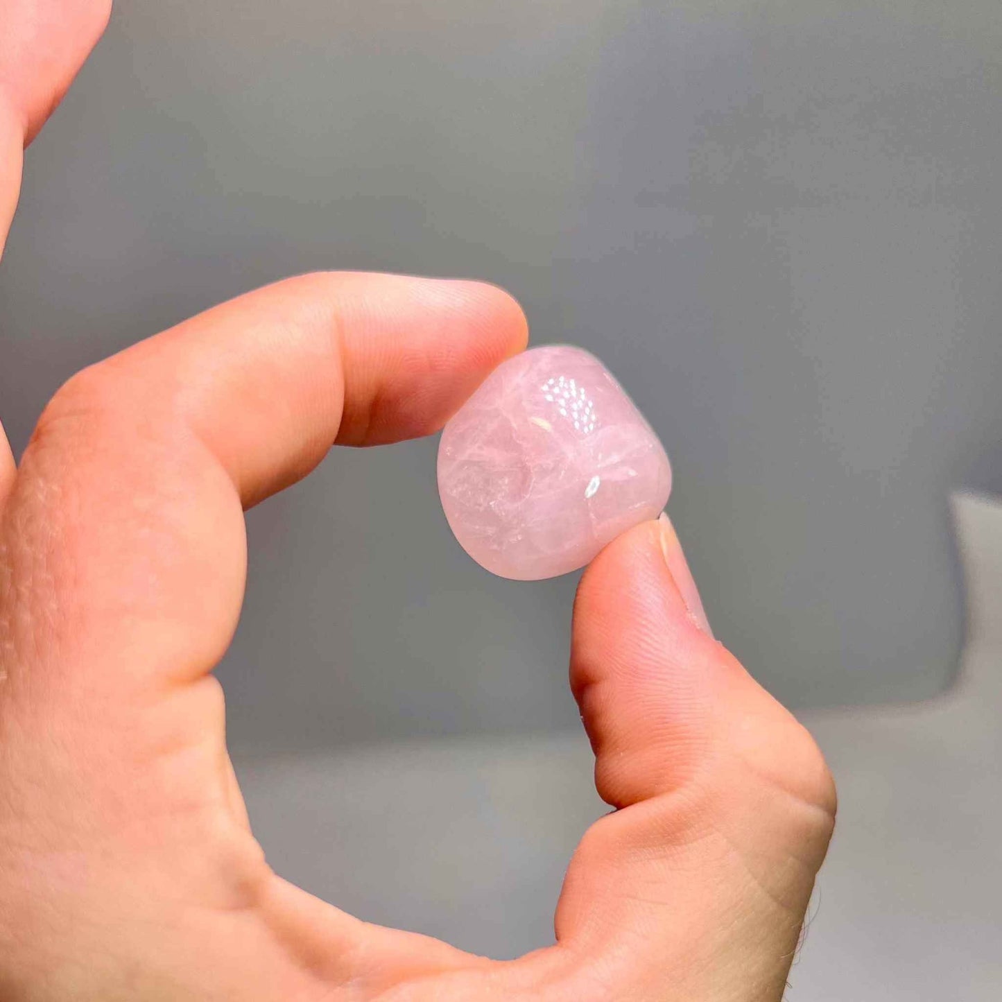 Soft translucent pink rose quartz tumbled pocket stone, further view