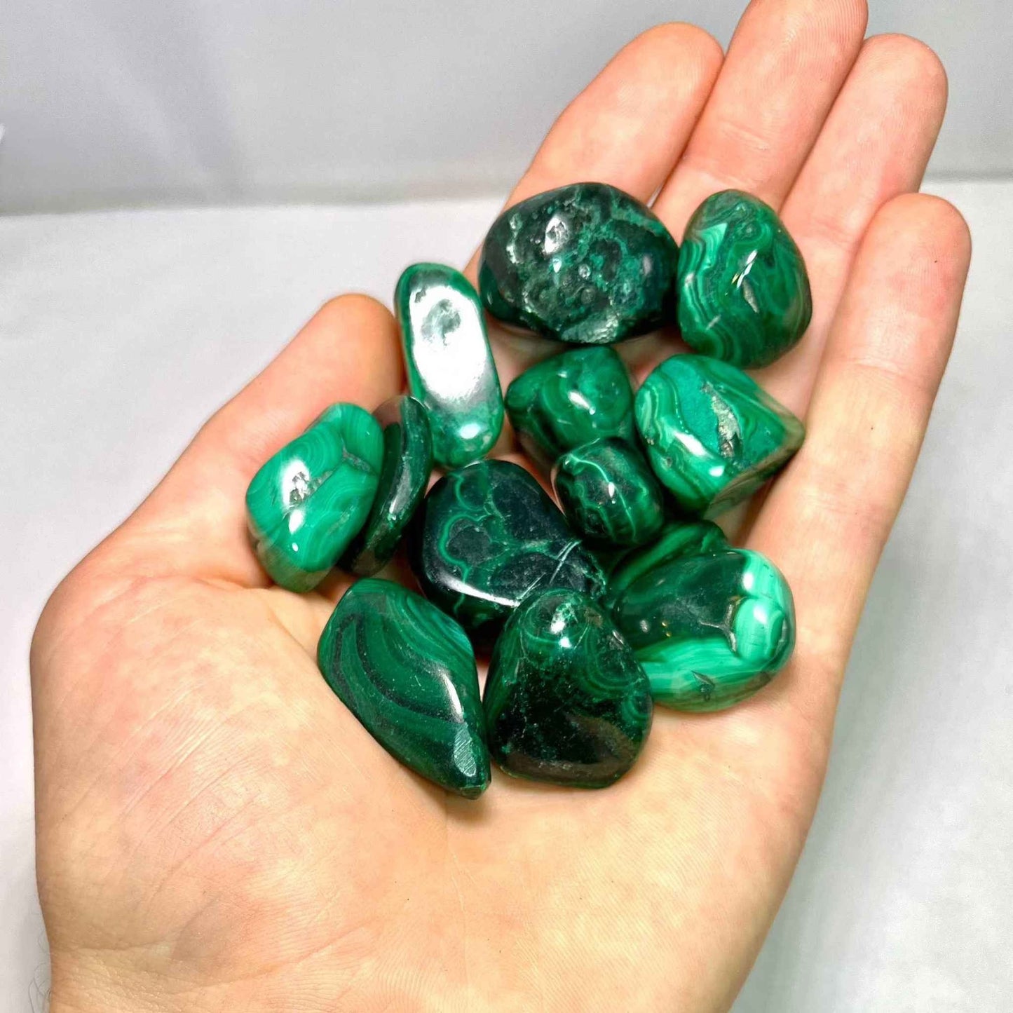 Close view of the swirling green banding in a Malachite stone