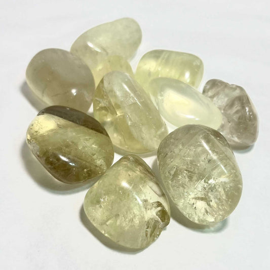 Pale golden natural citrine tumbled stone with warm translucency