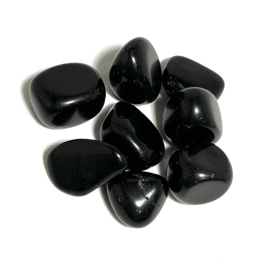 Glossy black tumbled Obsidian pocket stone with a mirror-like surface