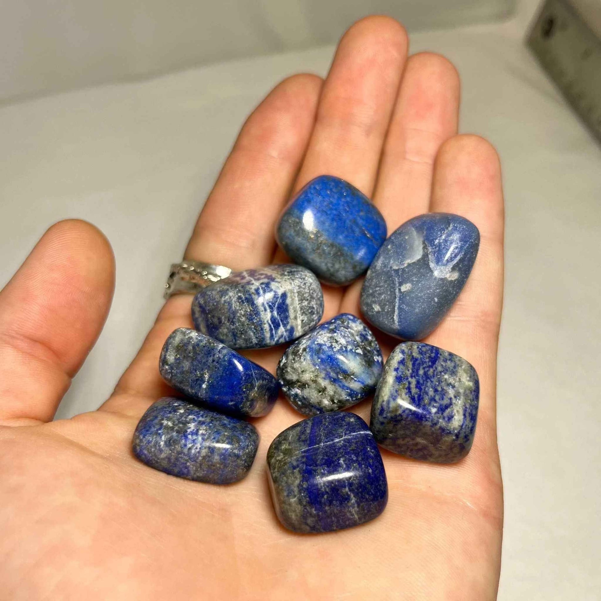 Close view of a polished lapis lazuli stone showing its rich blue color.