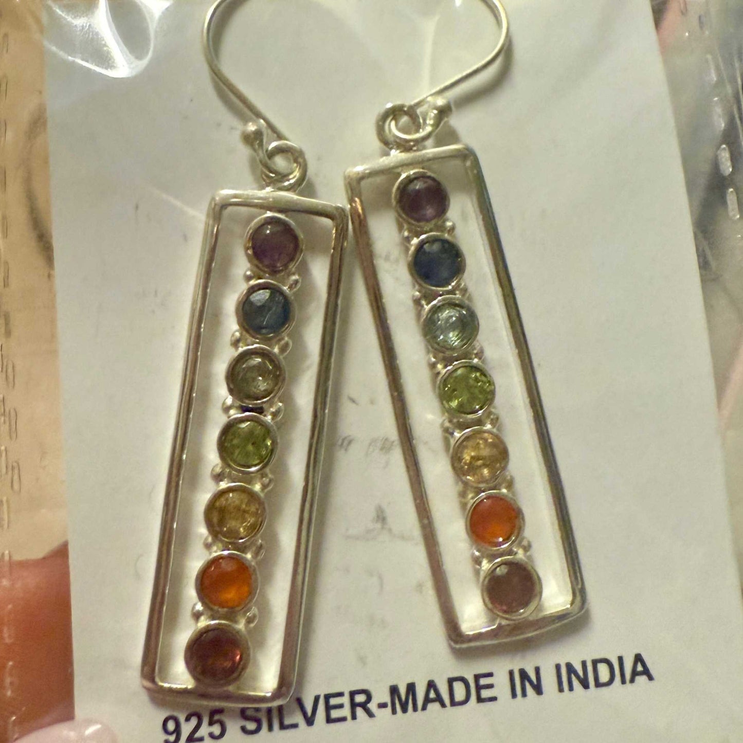 Pair of sterling silver bar dangle earrings, each set with seven small round chakra stones in rainbow order