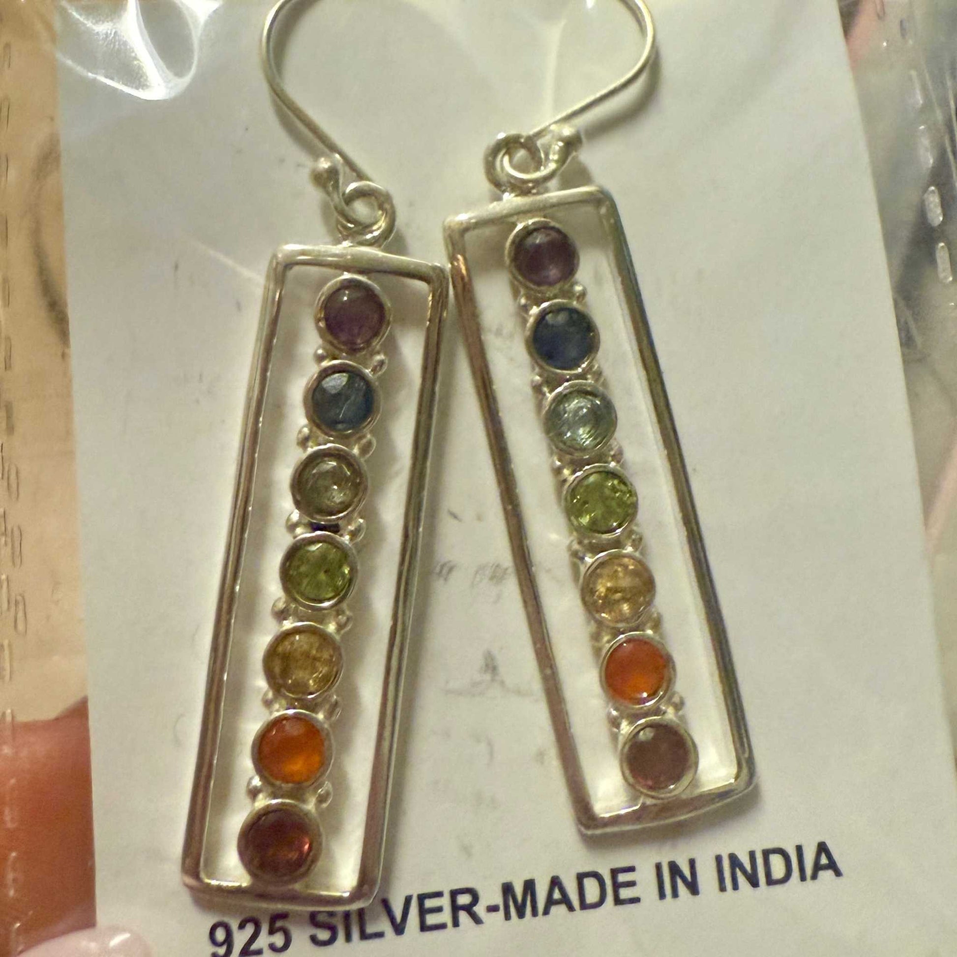 Pair of sterling silver bar dangle earrings, each set with seven small round chakra stones in rainbow order