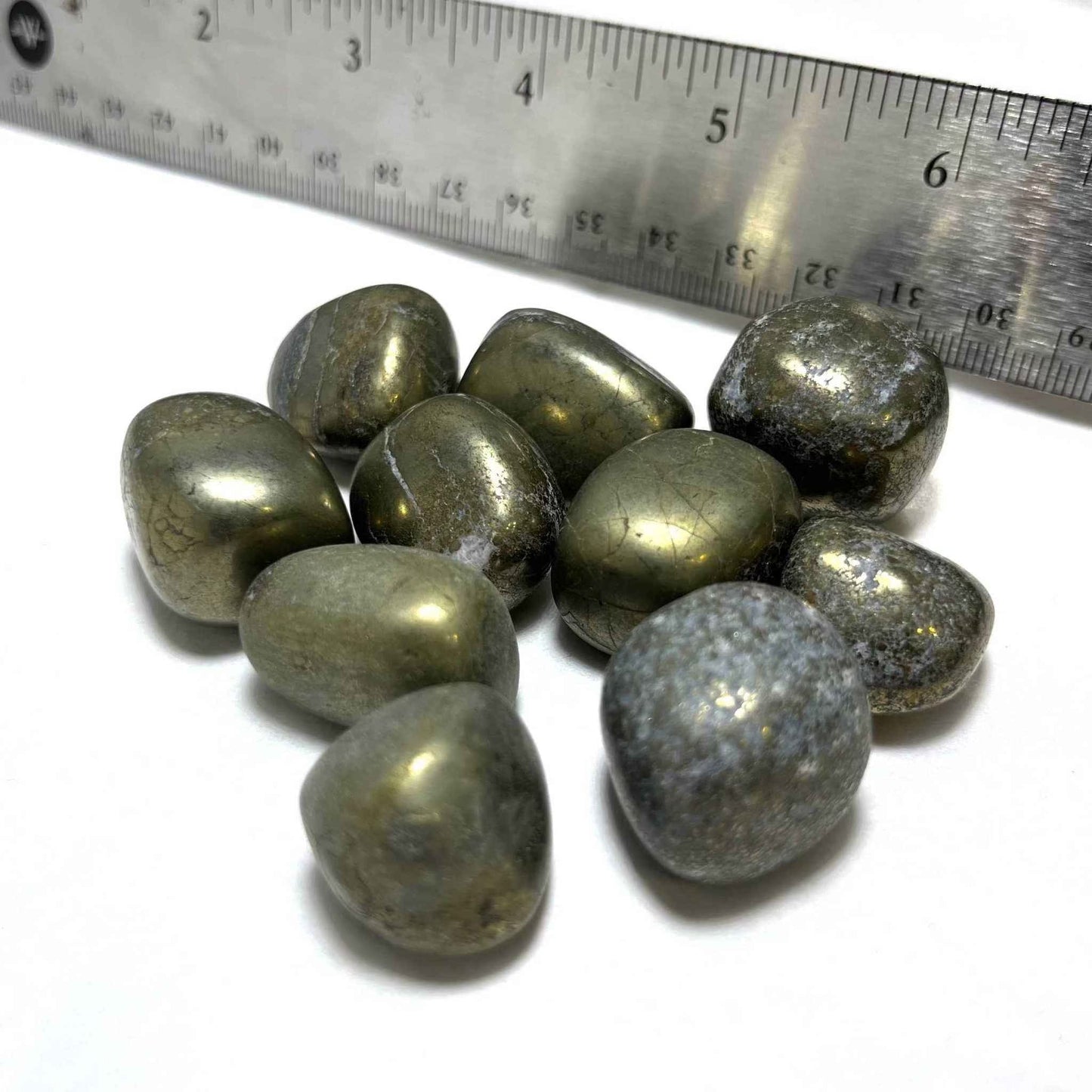 Polished golden Pyrite tumbled stone shown from a second angle