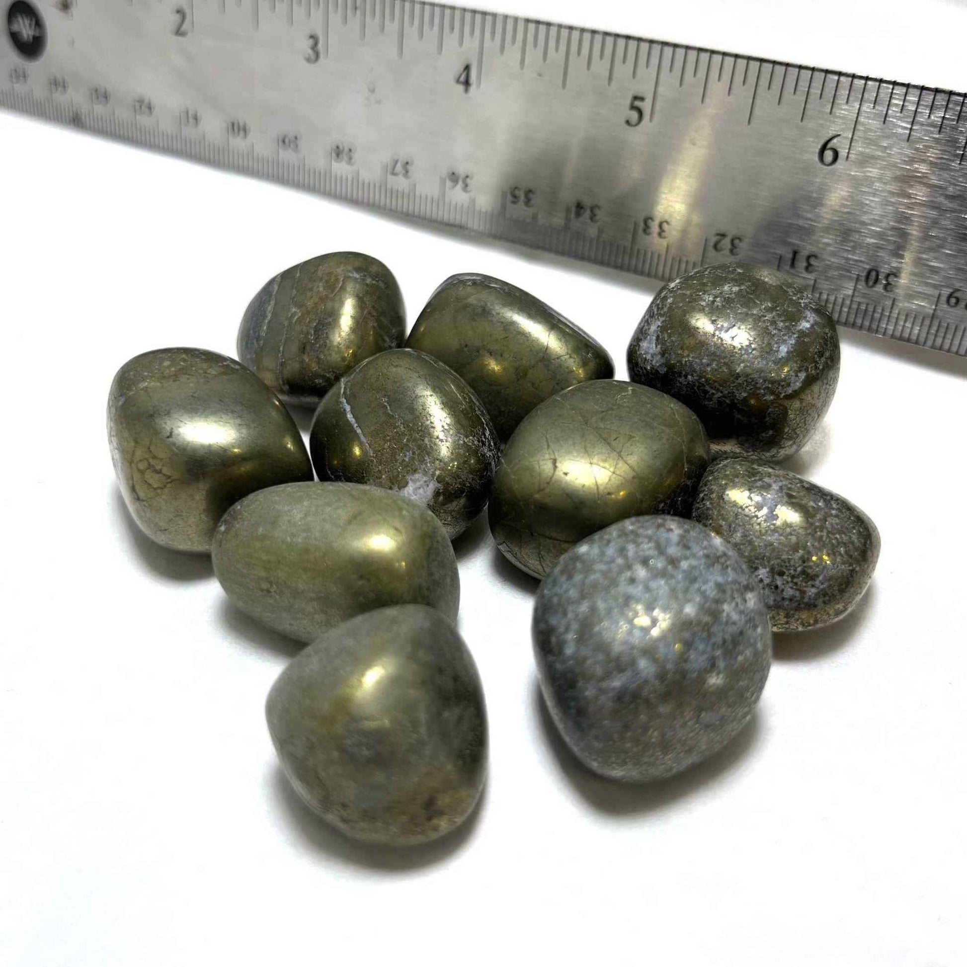 Polished golden Pyrite tumbled stone shown from a second angle