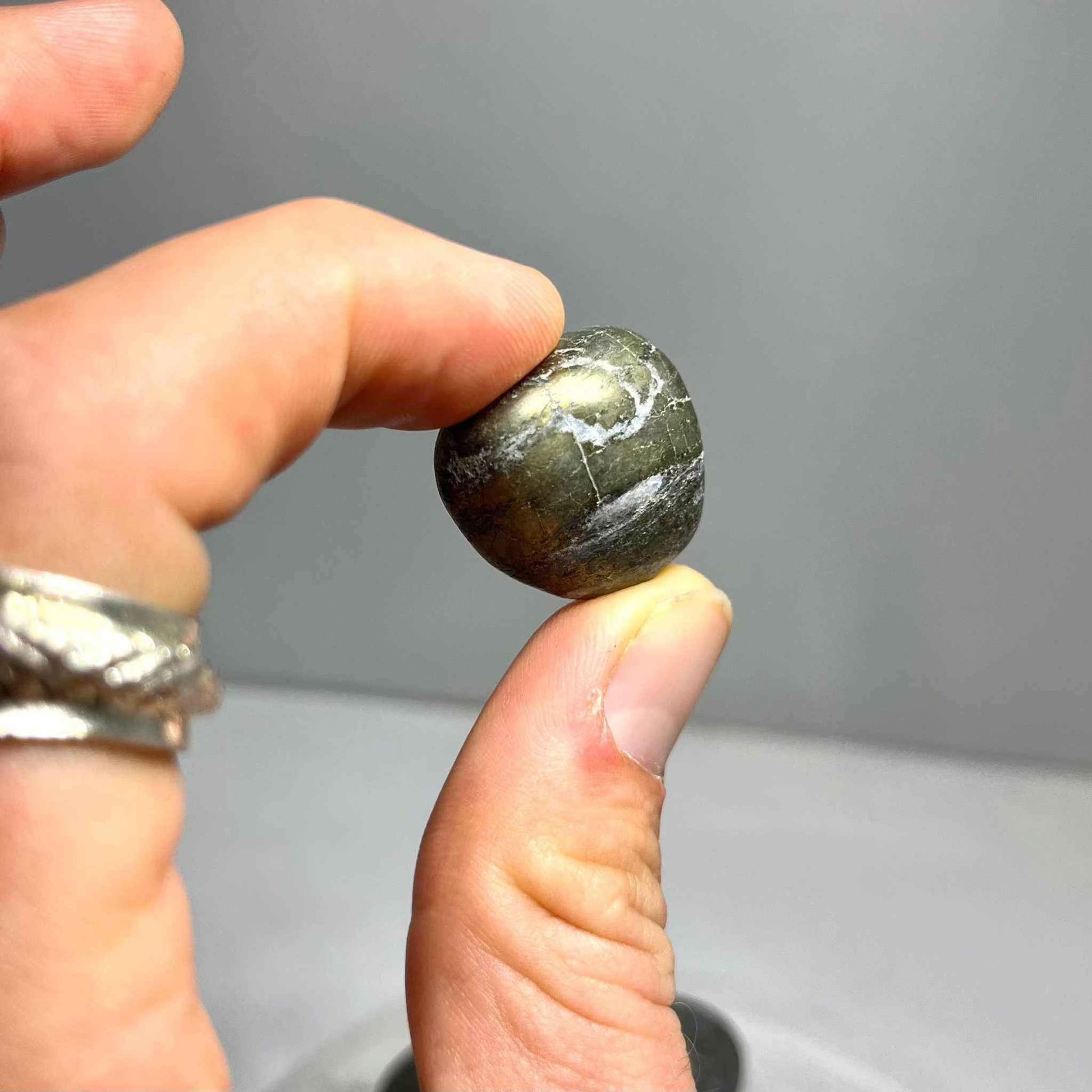 Several tumbled Pyrite stones showing natural variation in shape