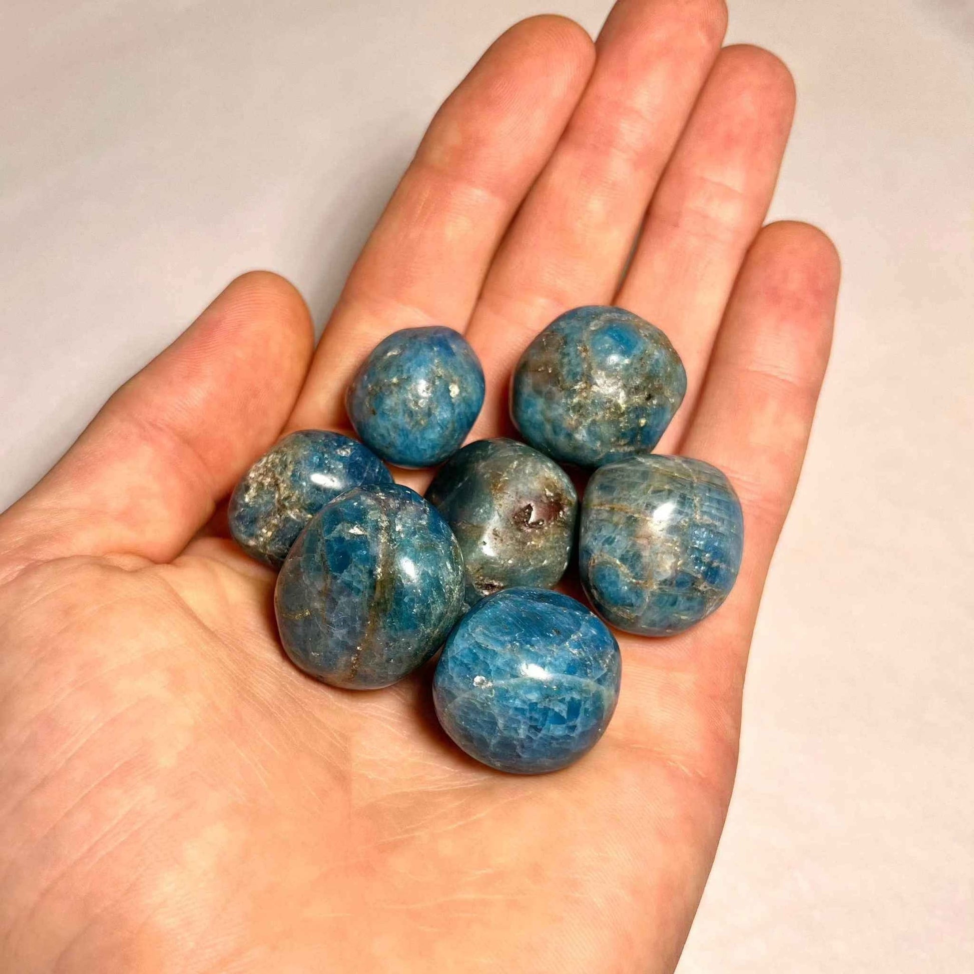 Close view of a tumbled blue apatite pocket stone
