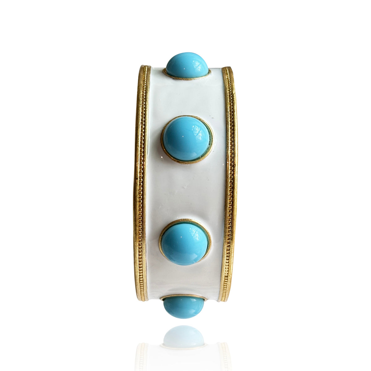 The white enamel bangle with turquoise-blue glass cabochons photographed upright on white.