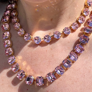 Two pink crystal necklaces worn layered, a round-stone strand above and an emerald-cut strand below; this listing is the emerald-cut necklace.