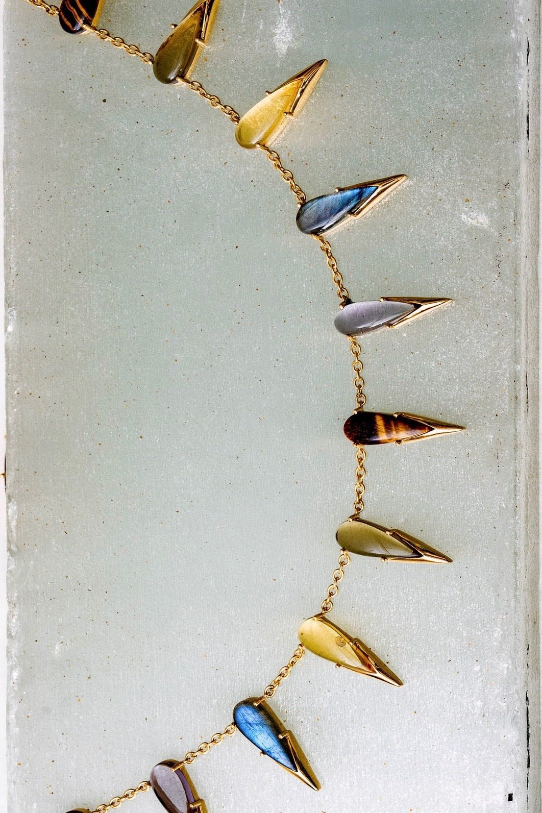 Saber Tooth Necklace in Angora (gold) — domed tiger eye, smoky quartz and labradorite stones capped with sharp gold tips on thin silver cable chain — view 4