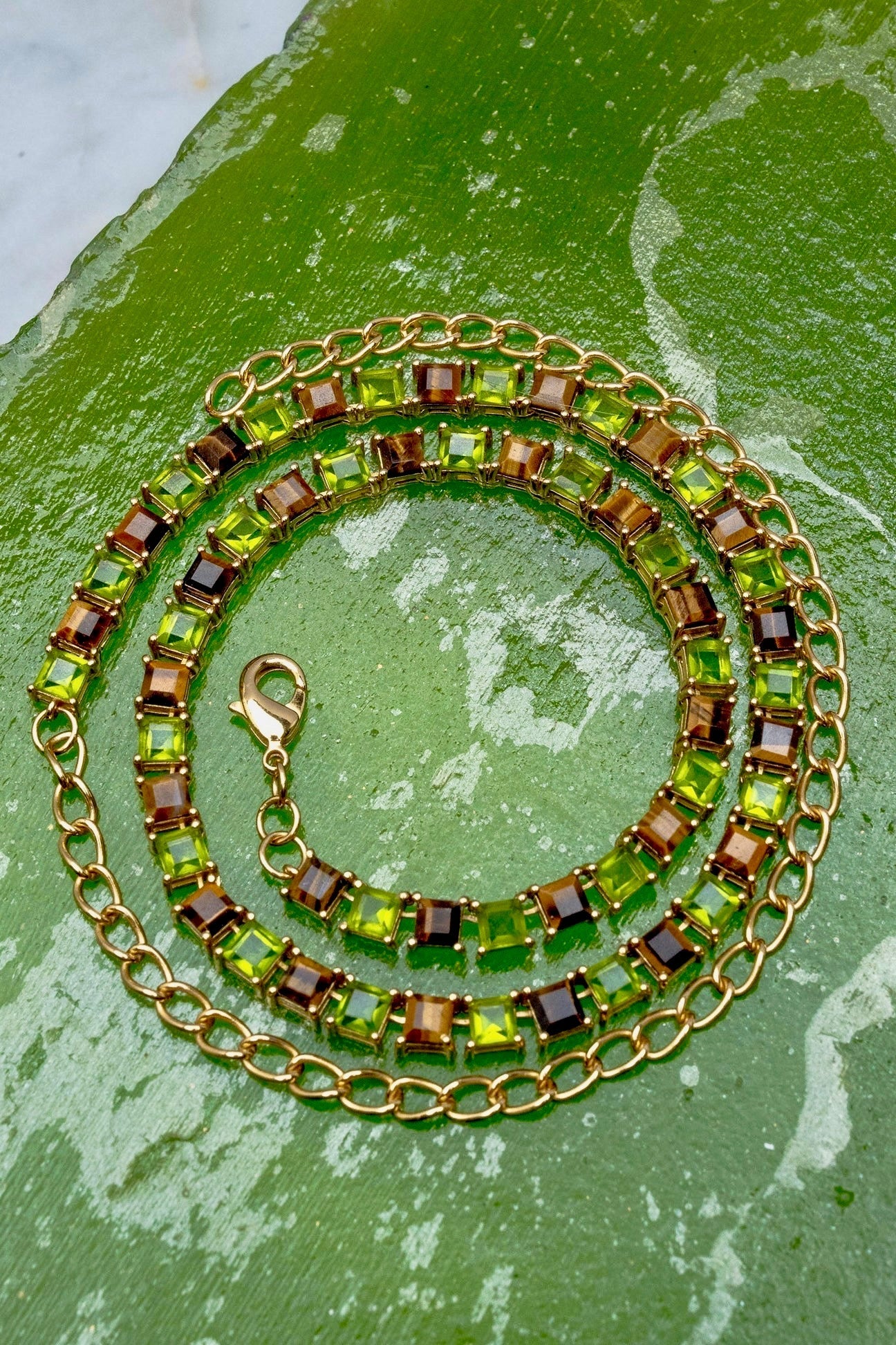 Tiger Eye and Poison Dart Tennis Necklace in gold — step-cut genuine tiger eye and bright green glass in a continuous line setting